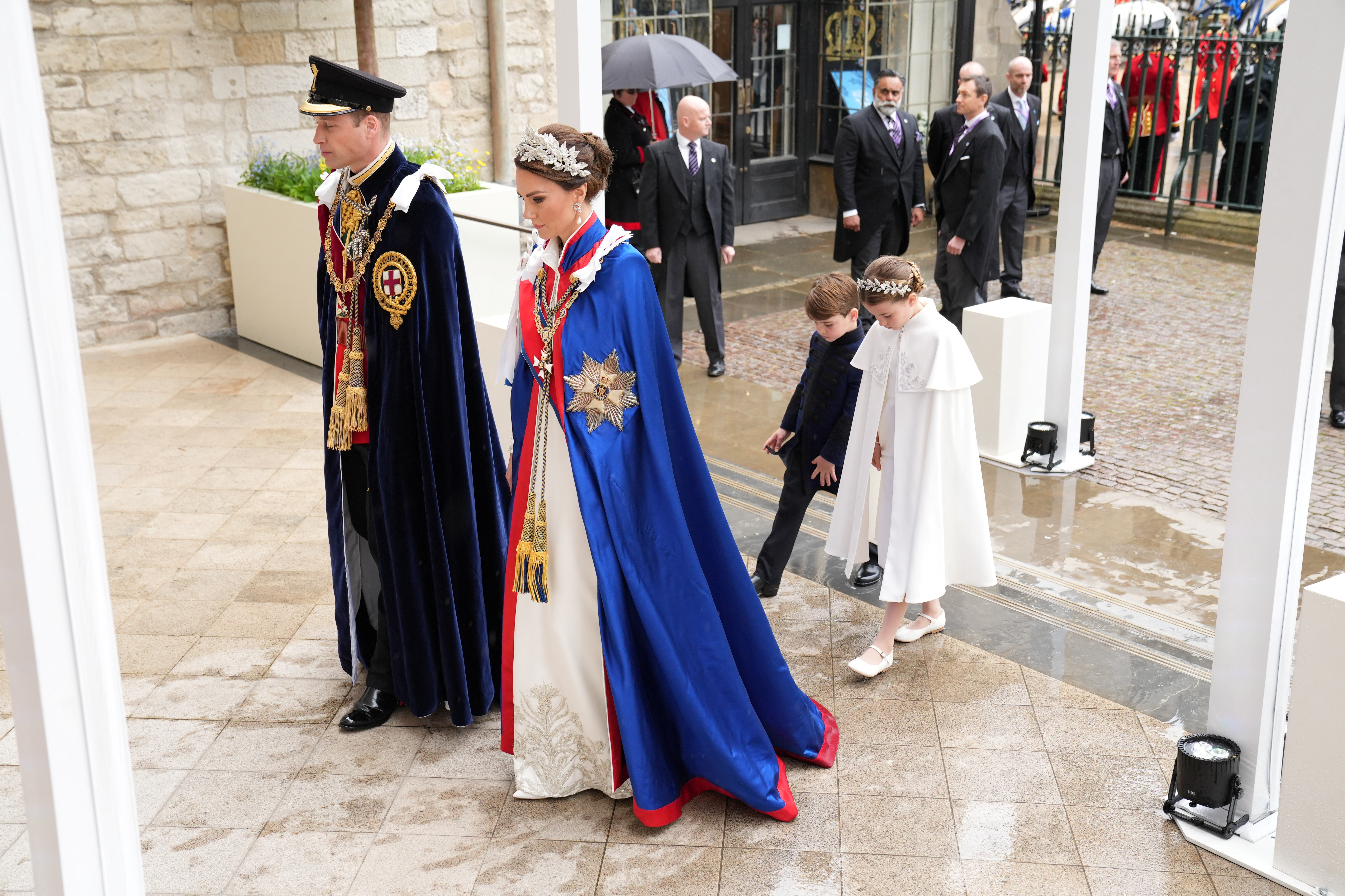 Royals wear historic robes, guests don bold colours for coronation