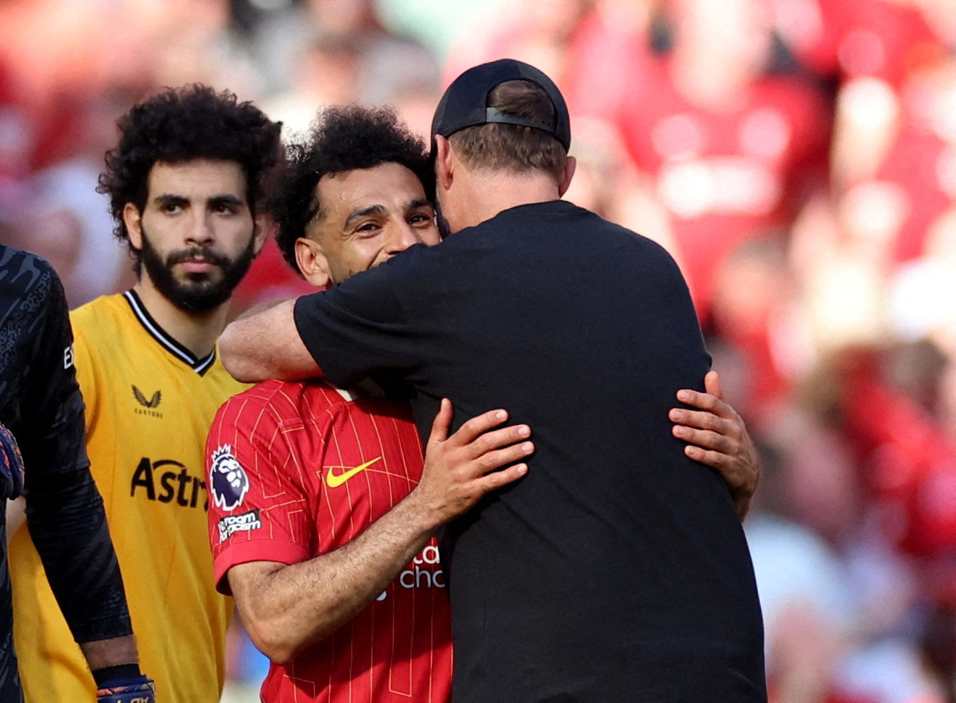Liverpool manager Juergen Klopp embraces Mohamed Salah