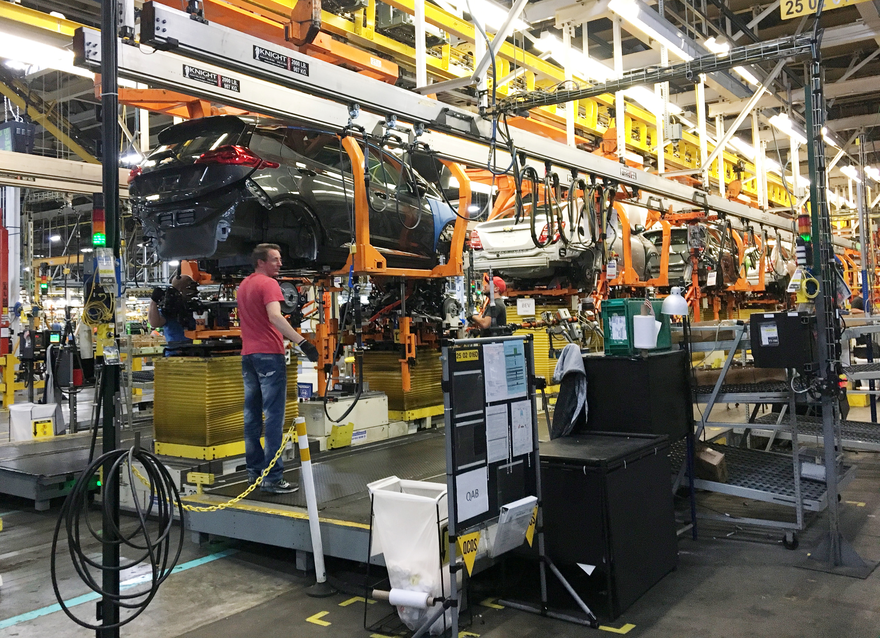 Workers assemble Chevy Bolt EV cars at the General Motors assembly plant in Orion Township