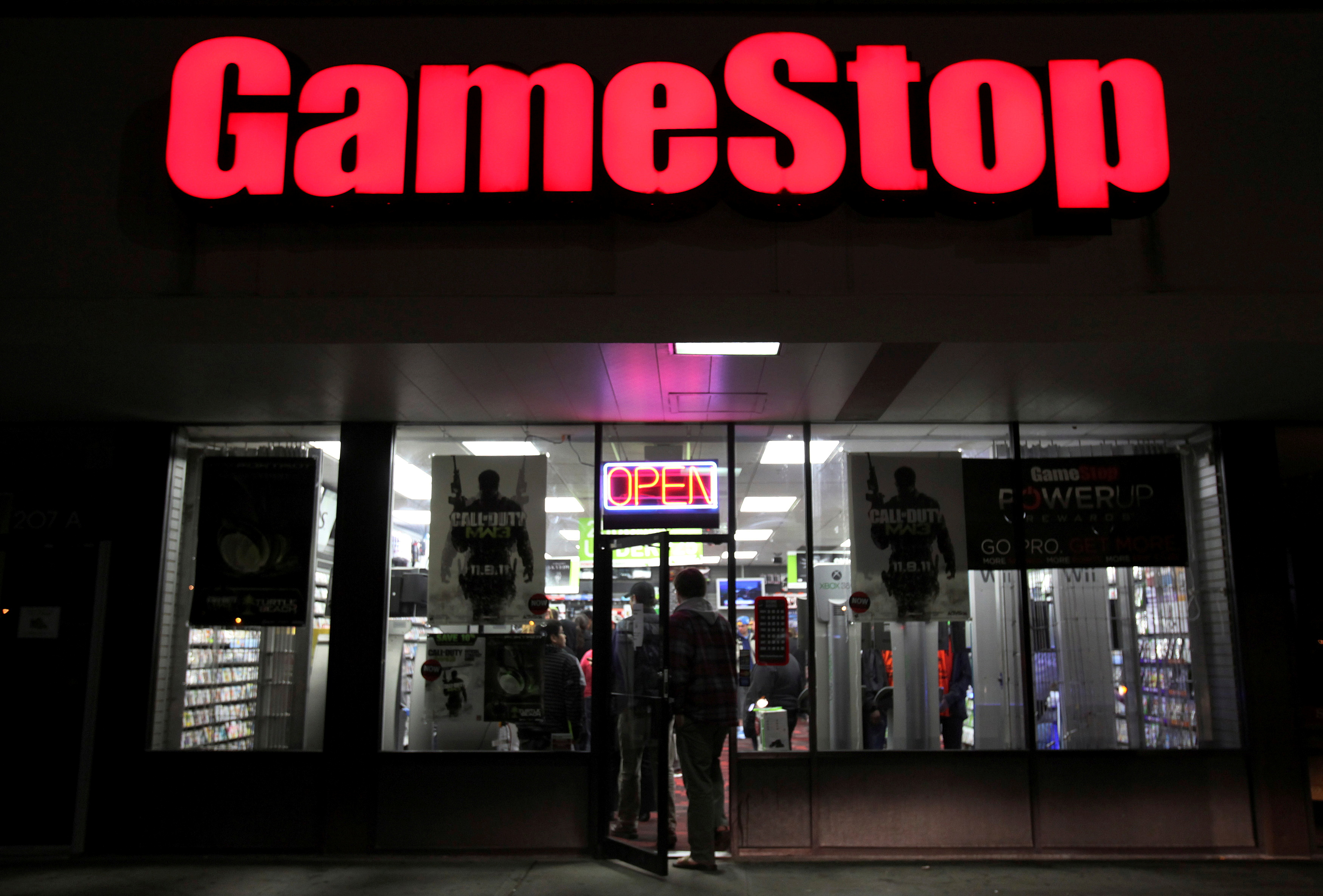 People enter a GameStop store during 