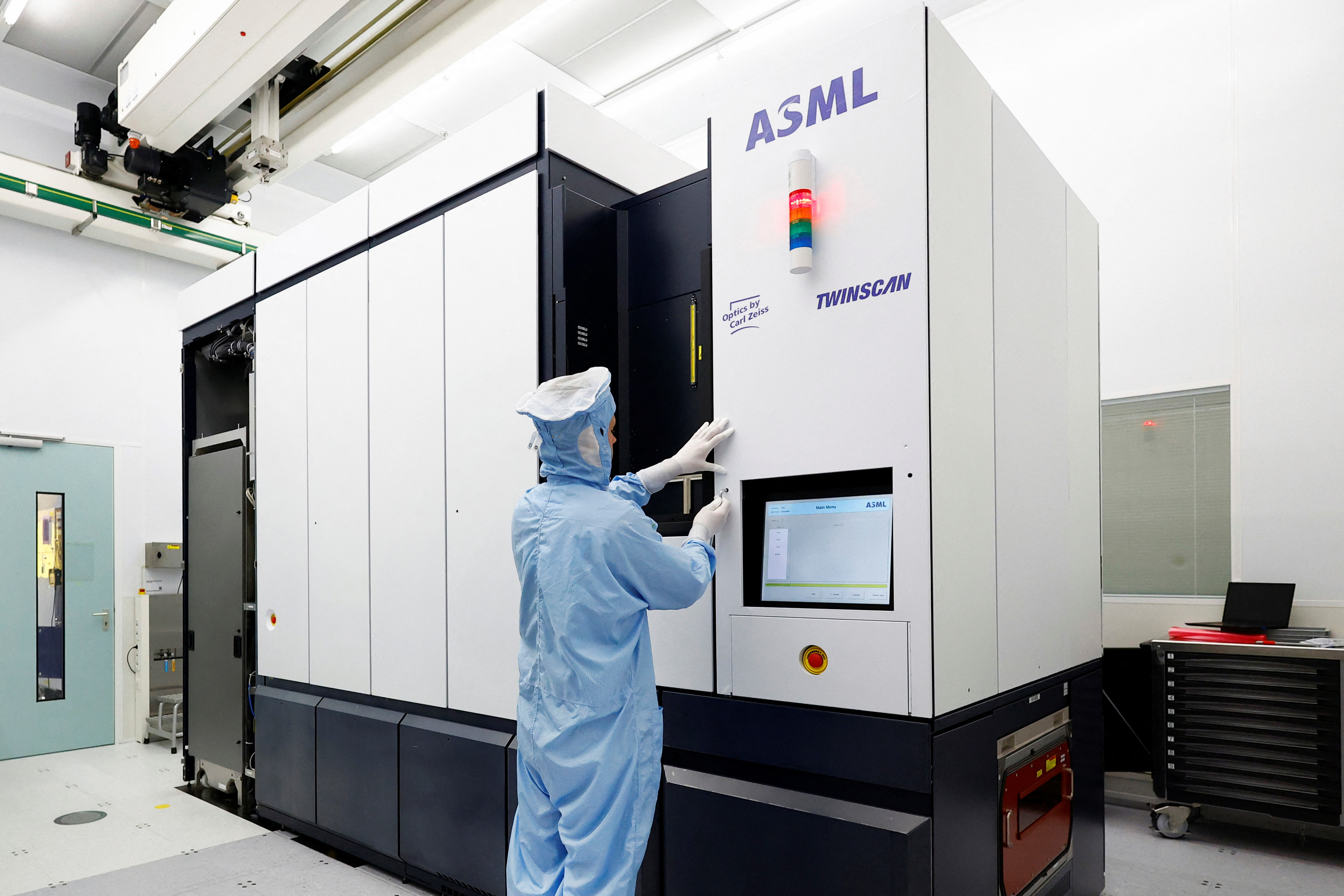 An assembly engineer works on a TWINSCAN DUV lithography system at ASML in Veldhoven
