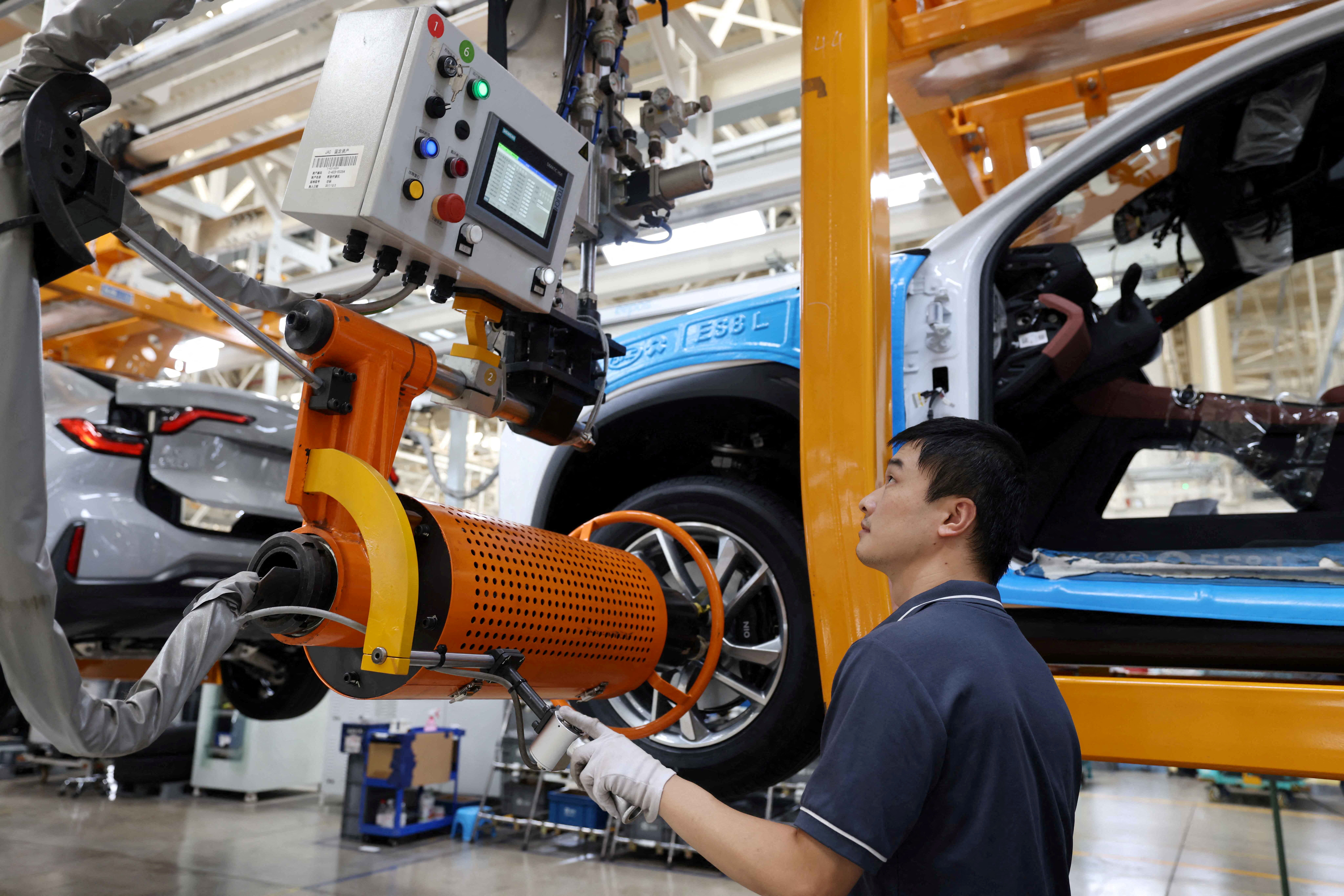Employee works on the production line of Nio electric vehicles in Hefei