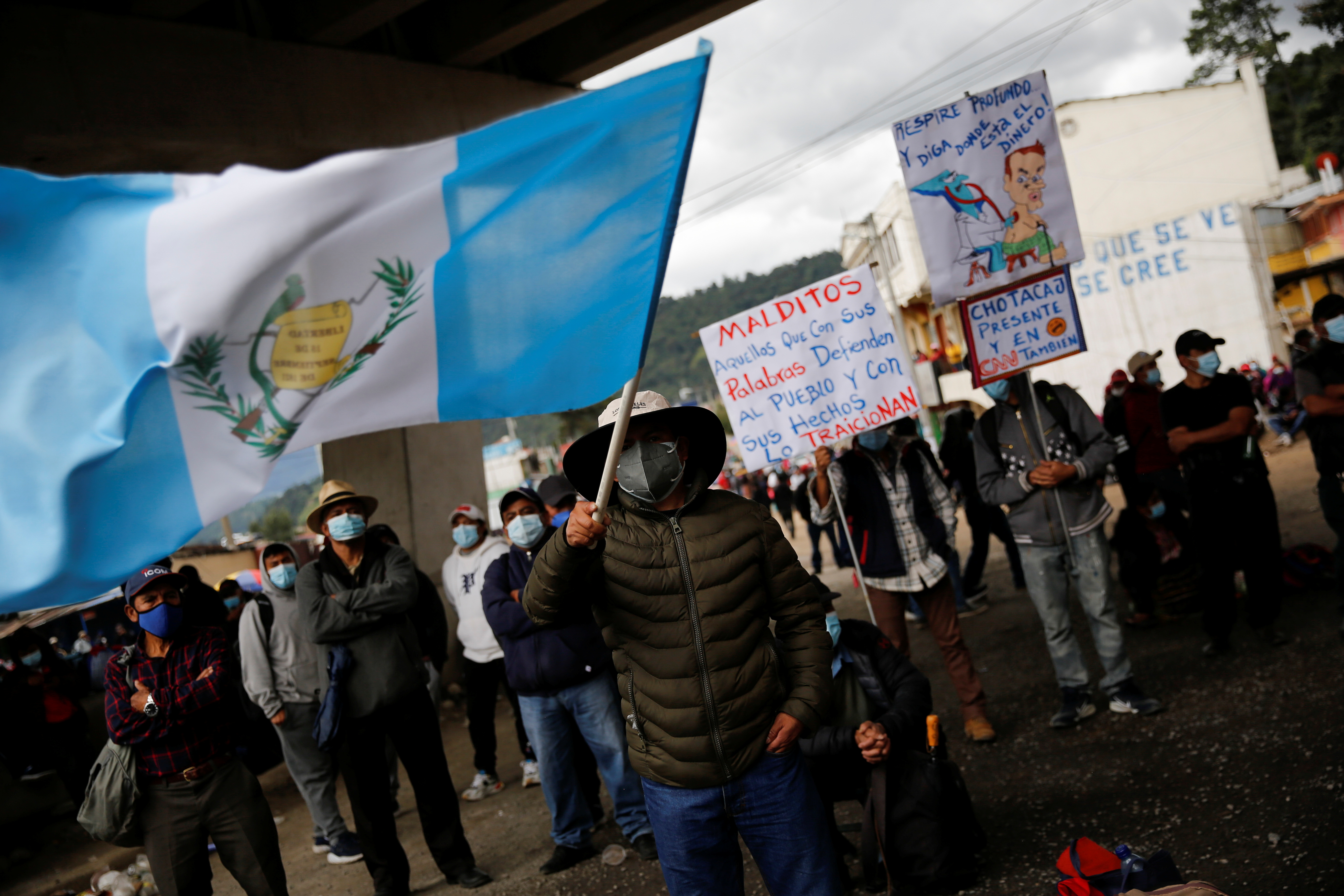 A Mayan indigenous man waves a Guatemala flag during a protest to demand the resignation of Guatemalan President Alejandro Giammattei and Attorney General Maria Porras, in San Cristobal Totonicapan, Guatemala July 29, 2021. REUTERS/Luis Echeverria