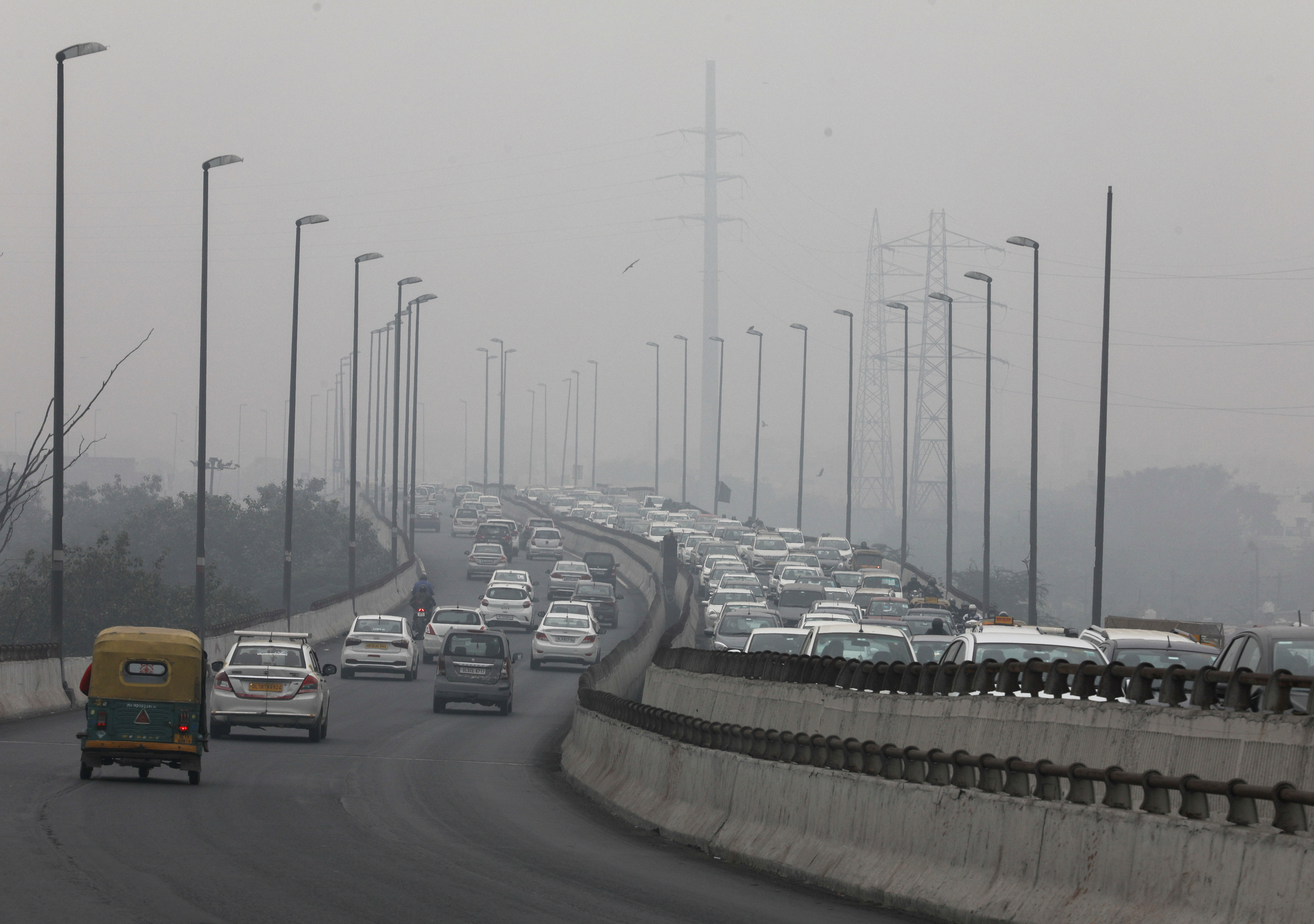 Vehicles are seen on a highway on a smoggy morning in New Delhi, India, December 2, 2021. REUTERS/Anushree Fadnavis