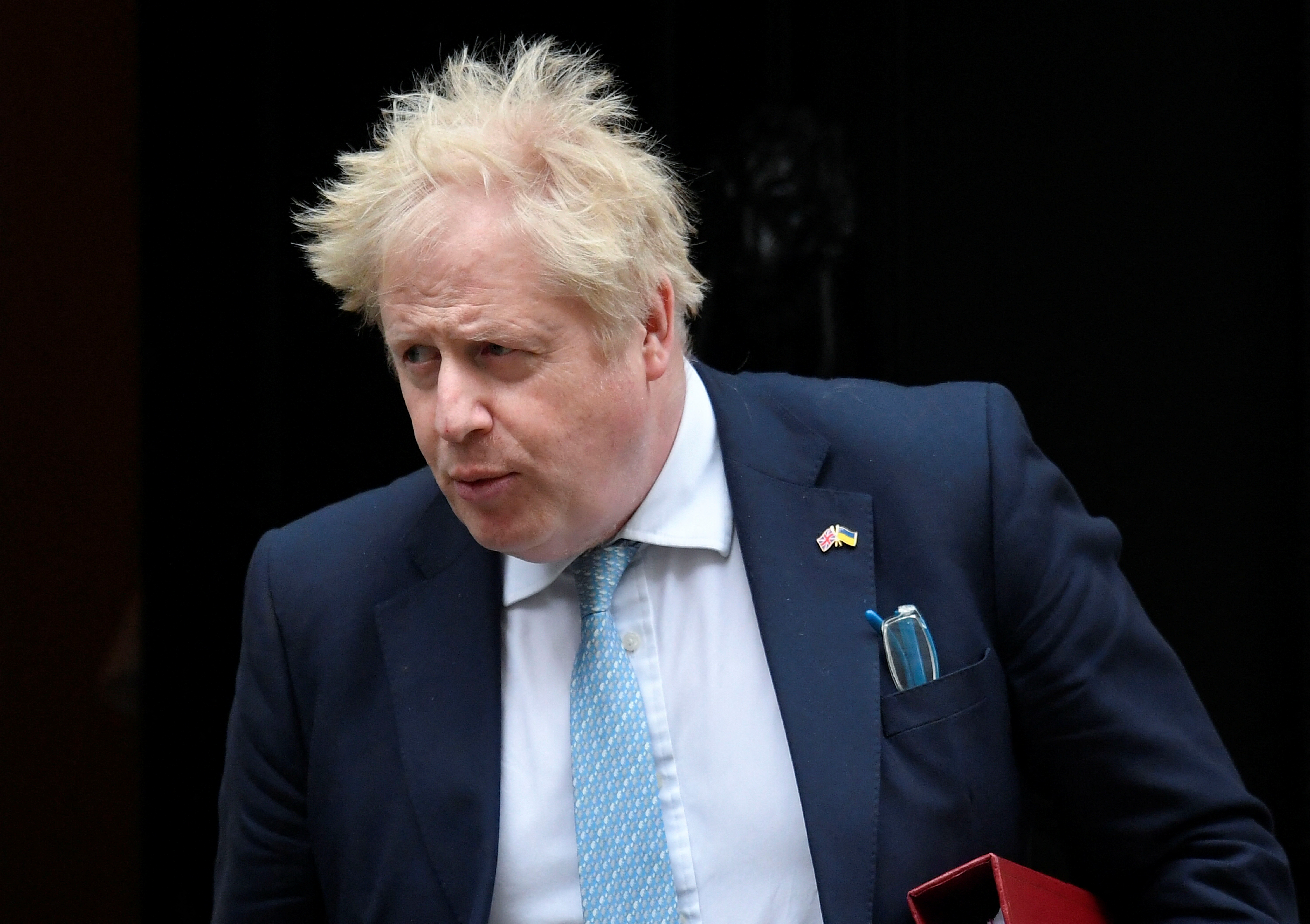 British PM Johnson leaves Downing Street to attend question time in Parliament in London