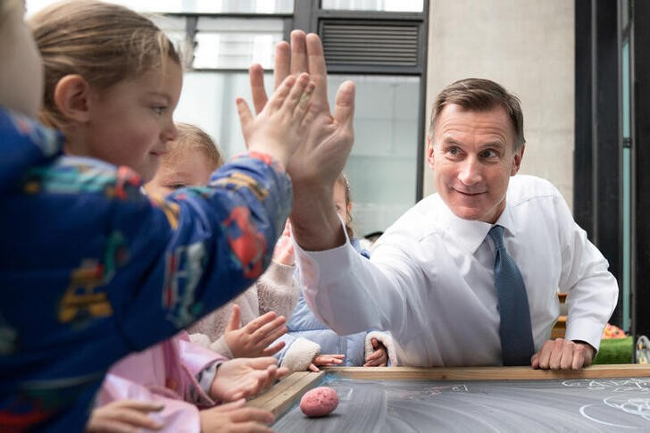 Chancellor of the Exchequer Jeremy Hunt meets children in London
