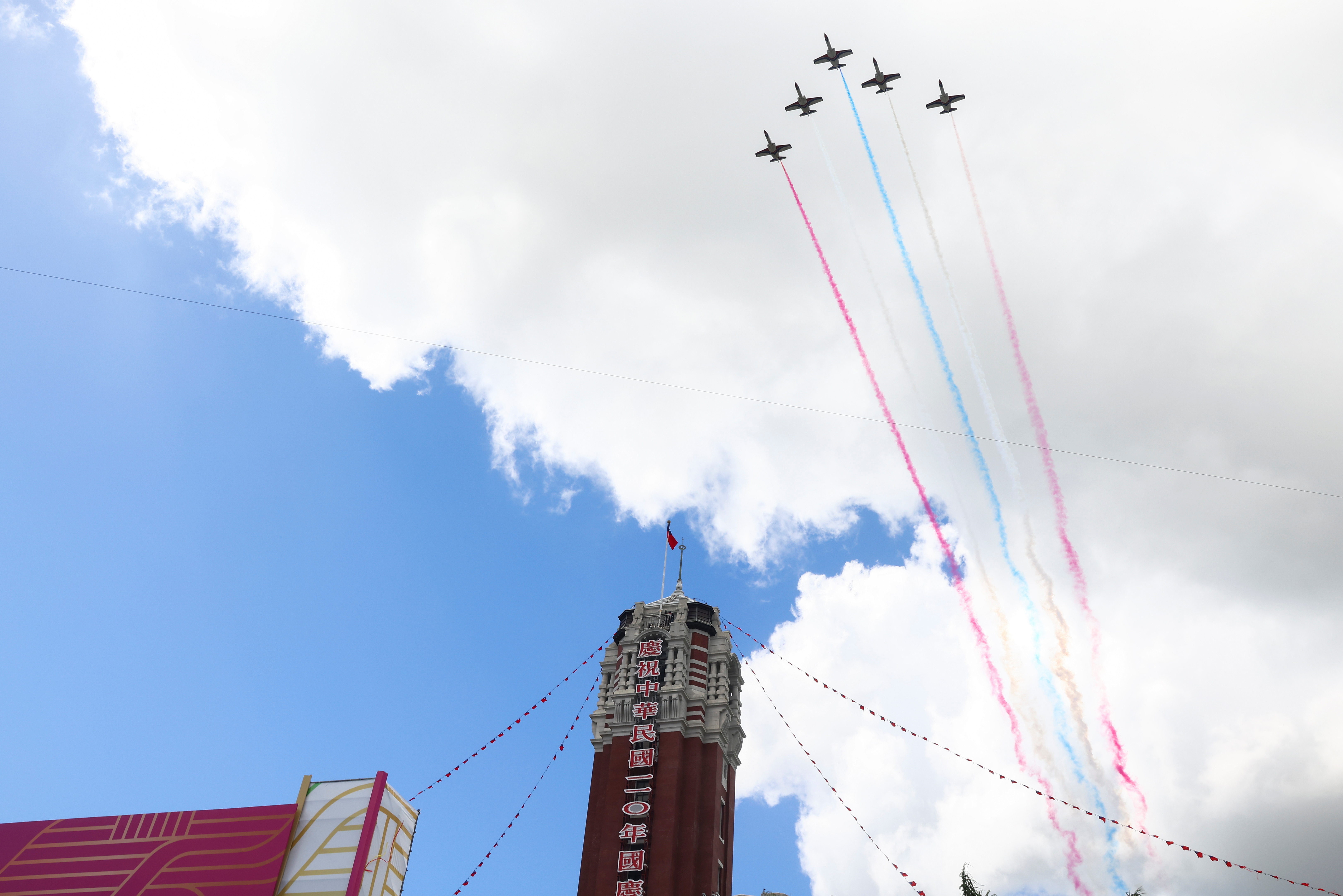 A formation of airplanes fly during the national day celebration in Taipei, Taiwan, October 10,2021. REUTERS/ Ann Wang