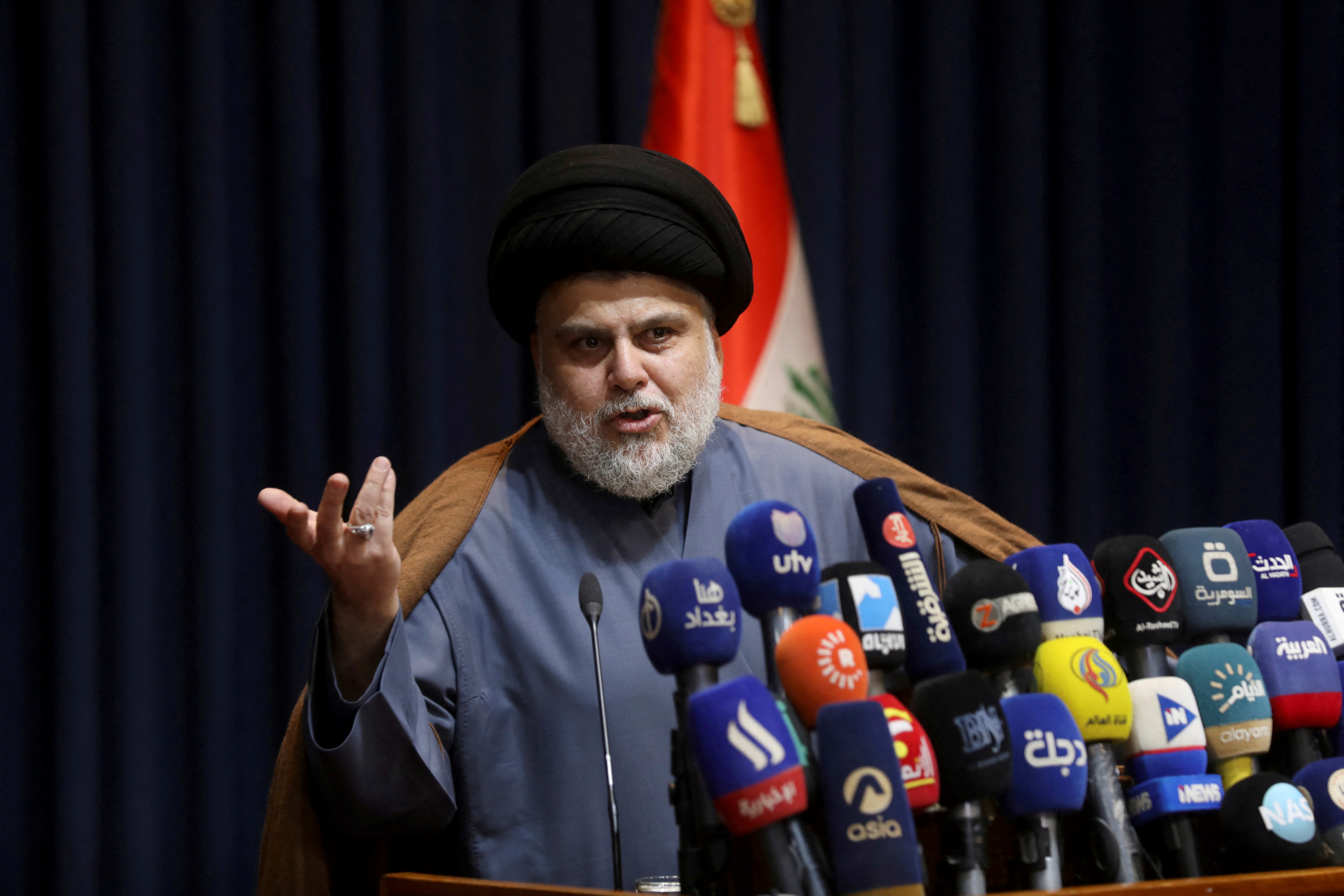 Iraqi Shi'ite cleric Muqtada al-Sadr speaks during a news conference in Najaf