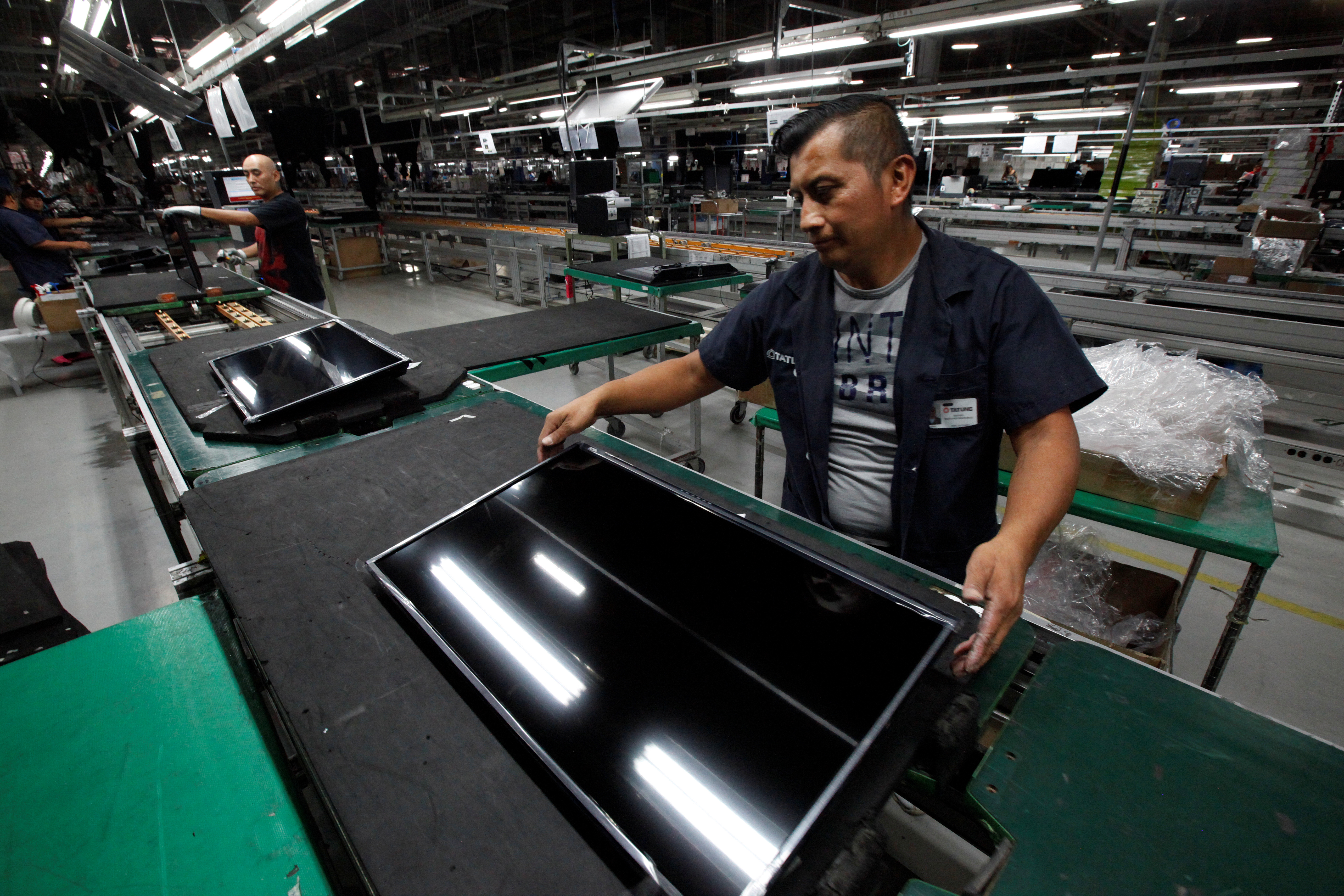 An employee works at an LED TV assembly line at a factory that exports to the U.S. in Ciudad Juarez