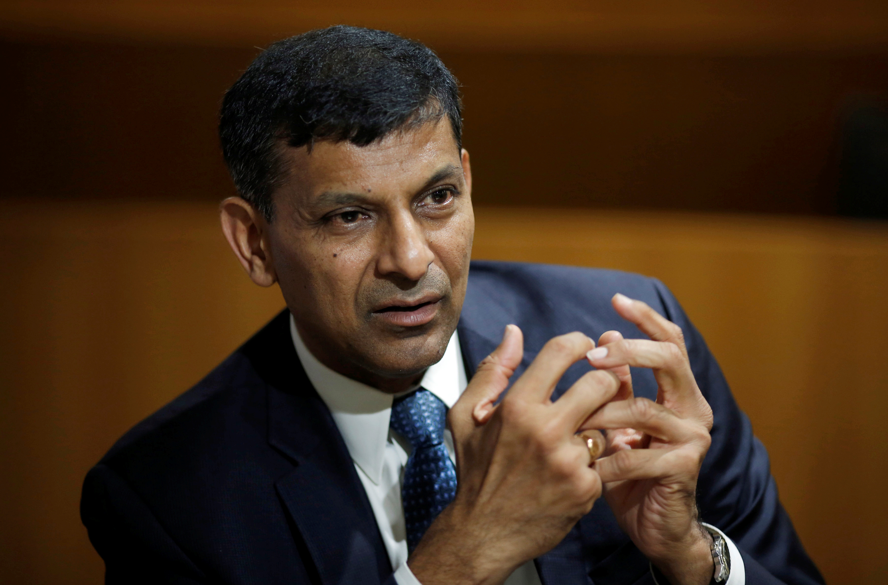 India’s former RBI Governor Rajan, gestures during an interview with Reuters in New Delhi