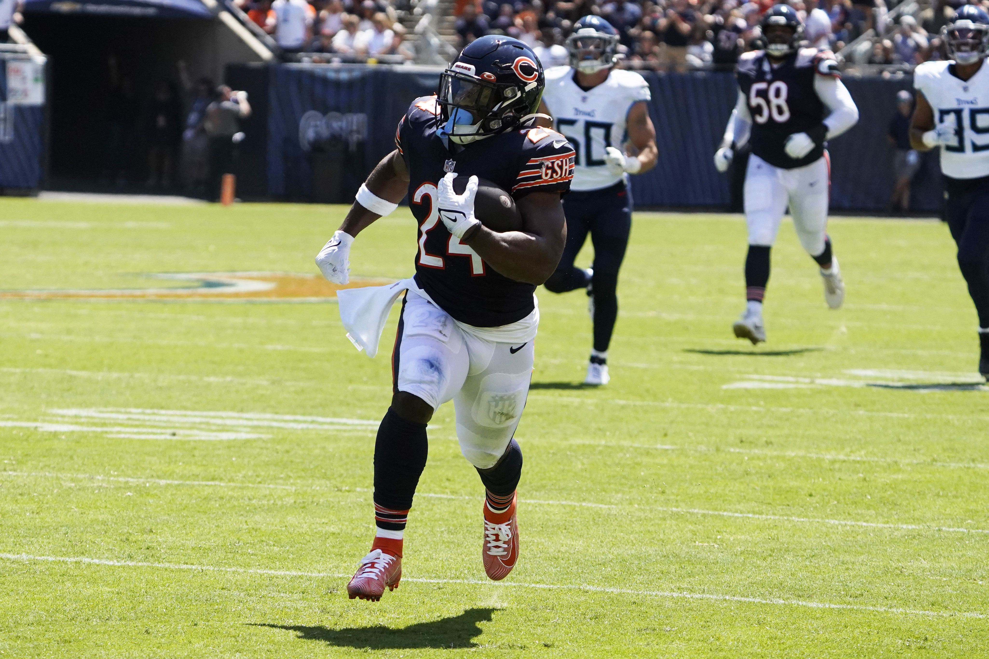 Chicago Bears defensive back Tre Roberson, left, scores a touchdown after  intercepting a pass against the Tennessee Titans in the first half of a  preseason NFL football game Saturday, Aug. 28, 2021