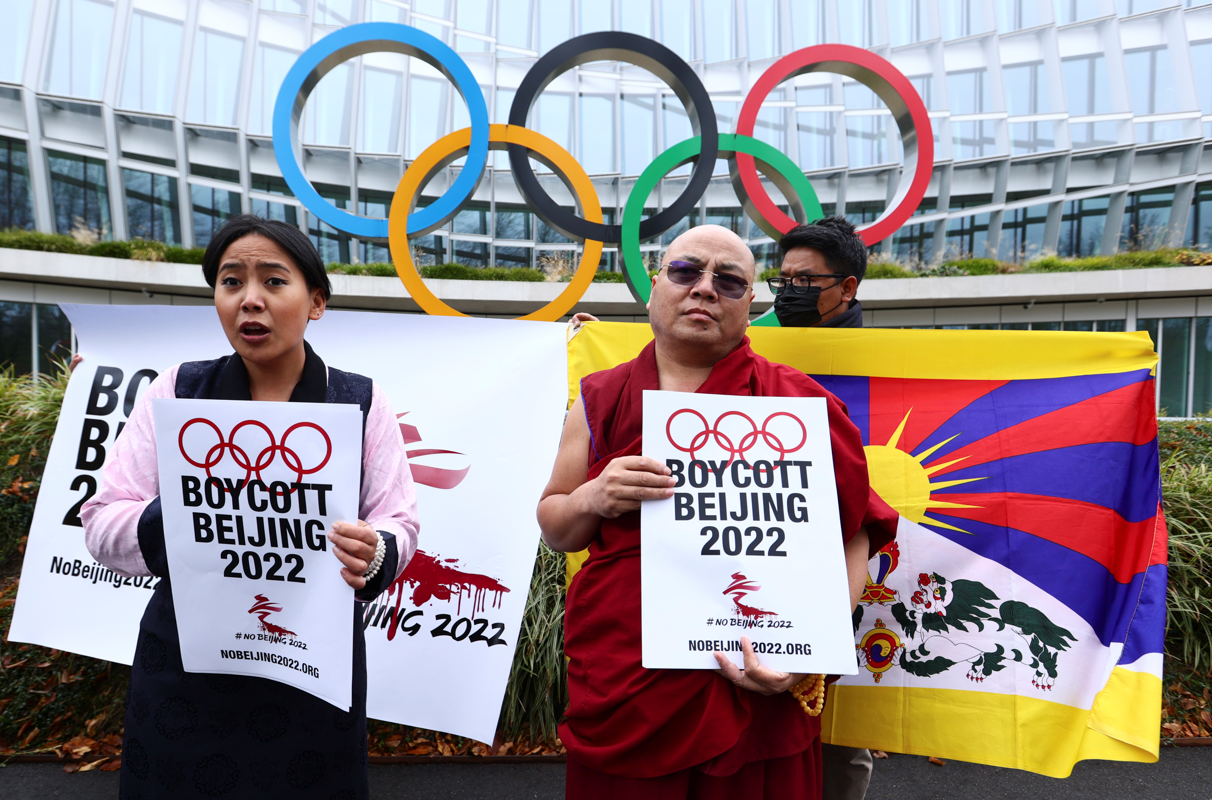 Chemi Lhamo and Golog Jigme Gyatso join protesters for a mock funeral outside the International Olympic Committee (IOC) headquarters as part of the No Beijing 2022 campaign, a coalition of over 180 rights groups that are calling for a boycott of Beijing 2022, in Lausanne, Switzerland November 26, 2021. REUTERS/Denis Balibouse
