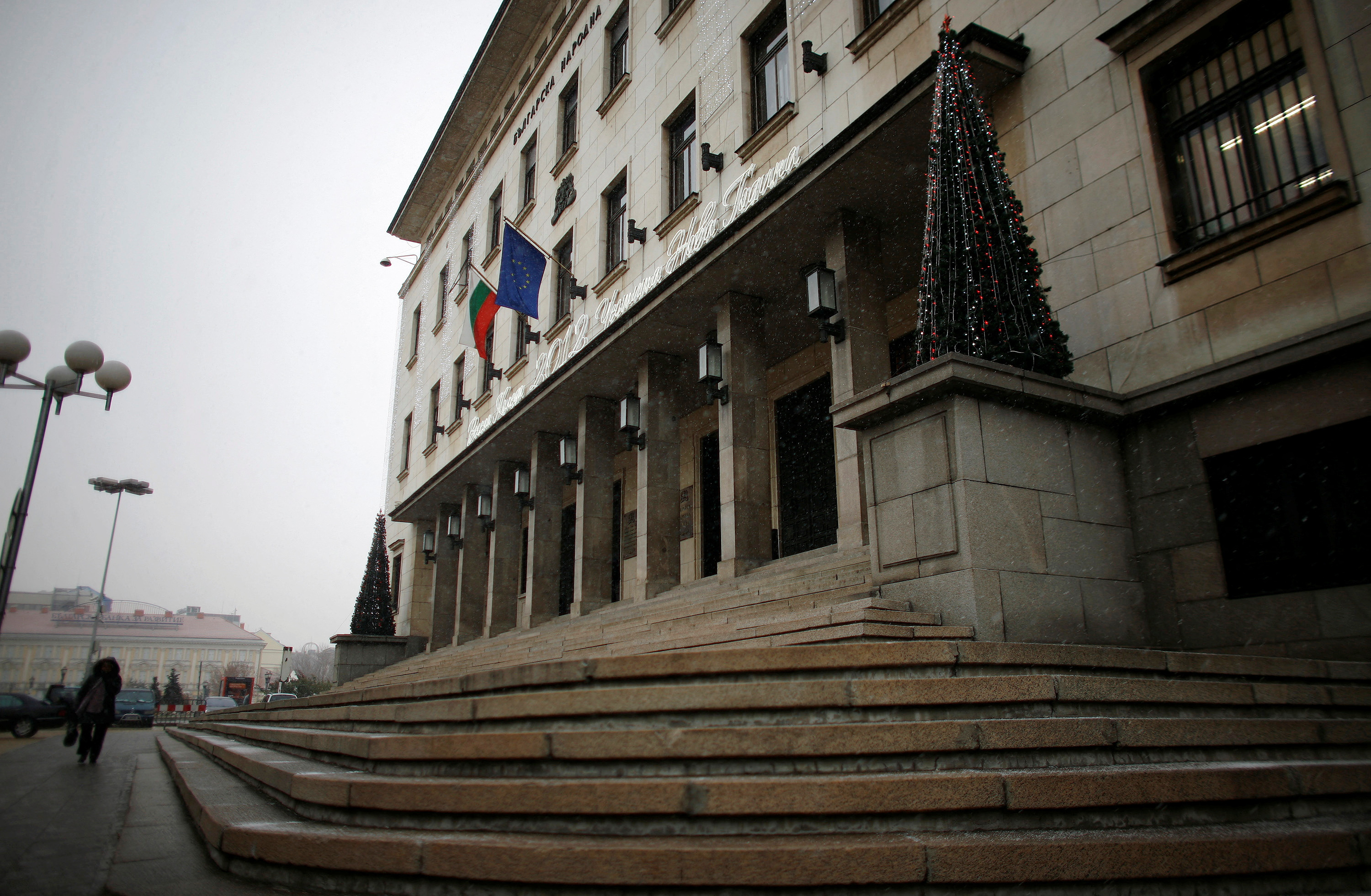A woman walks in front of the Bulgarian National Bank building in central Sofia