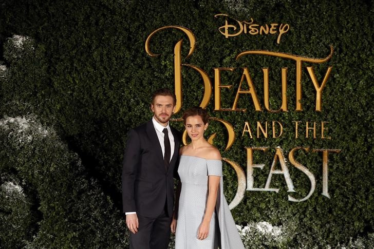 Actors Dan Stevens and Emma Watson pose for photographers at a media event for the film Beauty and the Beast in London
