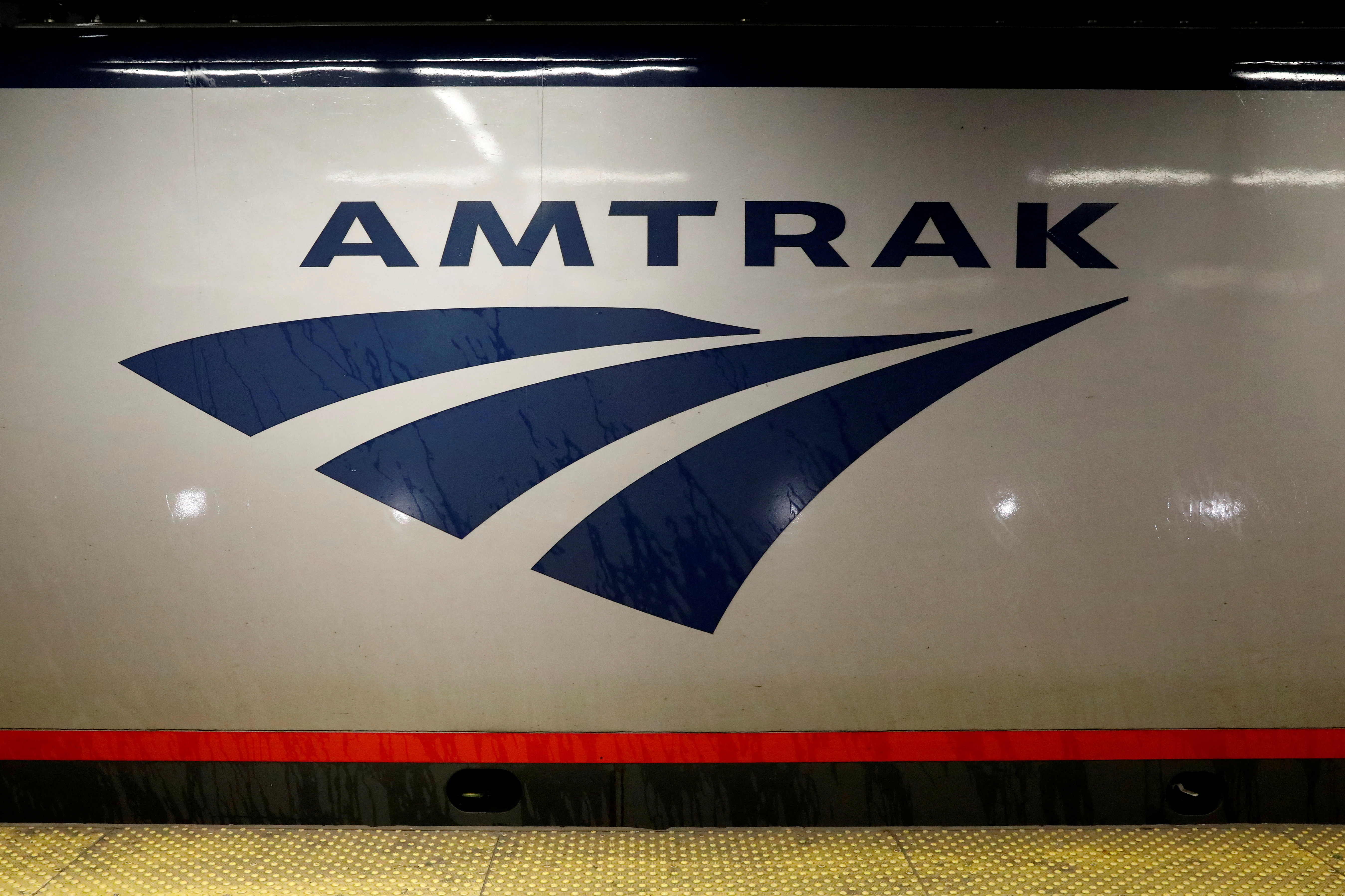 An Amtrak train is parked at the platform inside New York's Penn Station