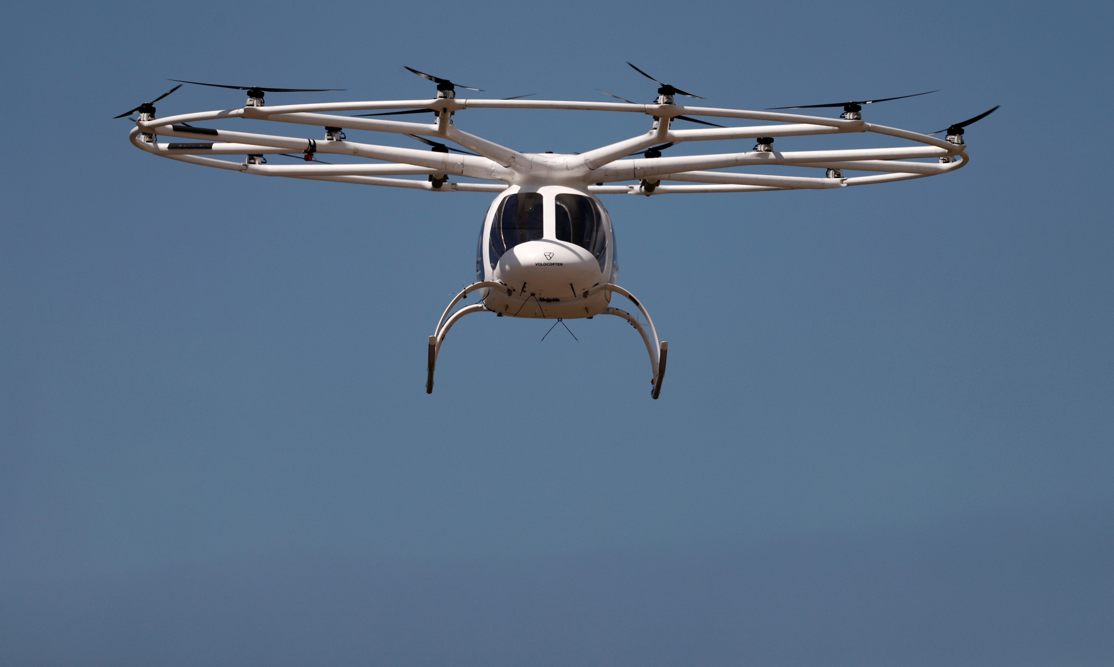 A Volocopter air-taxi performs a flight over Le Bourget airport