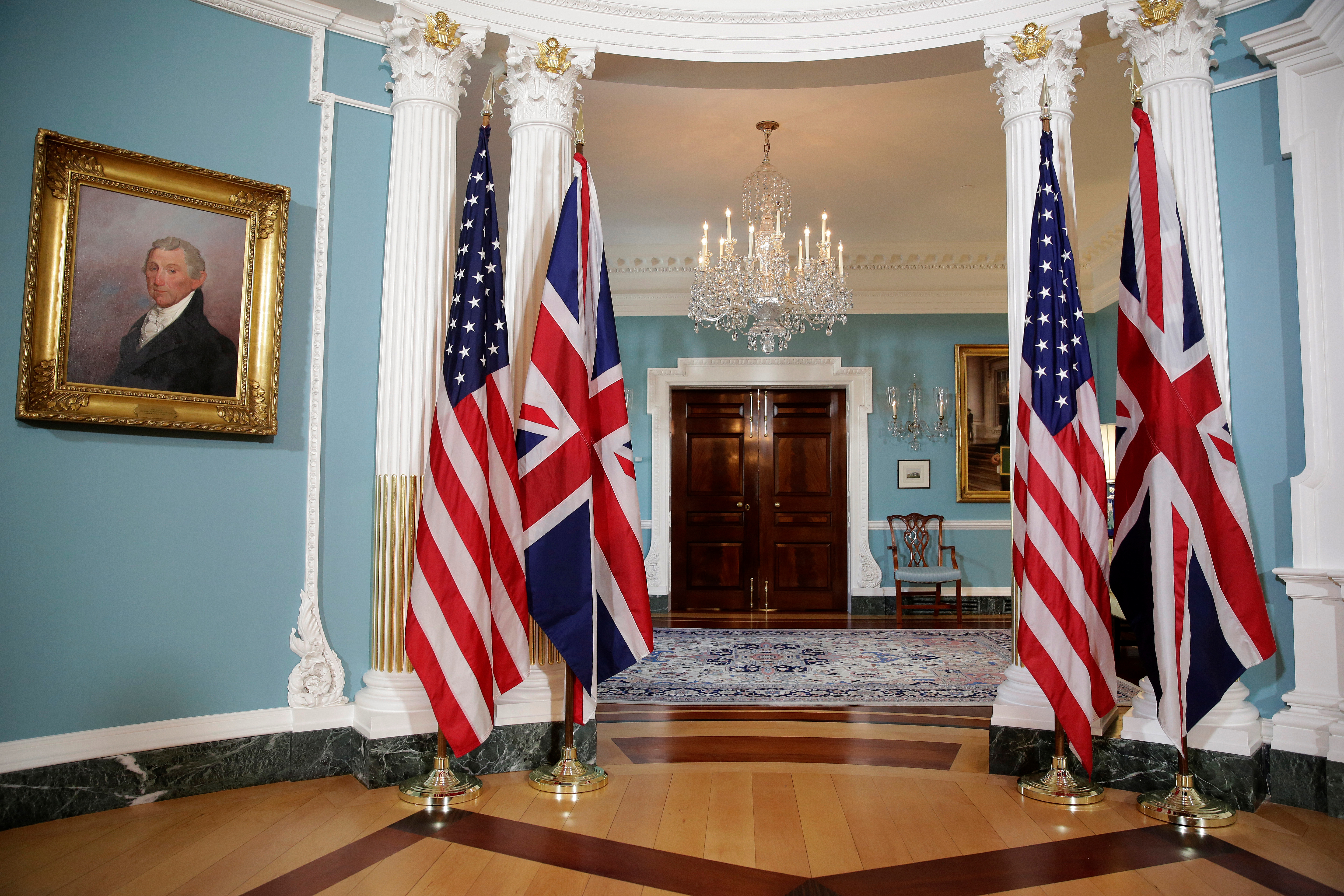The flags of the United States and the United Kingdom stand at the State Department in Washington
