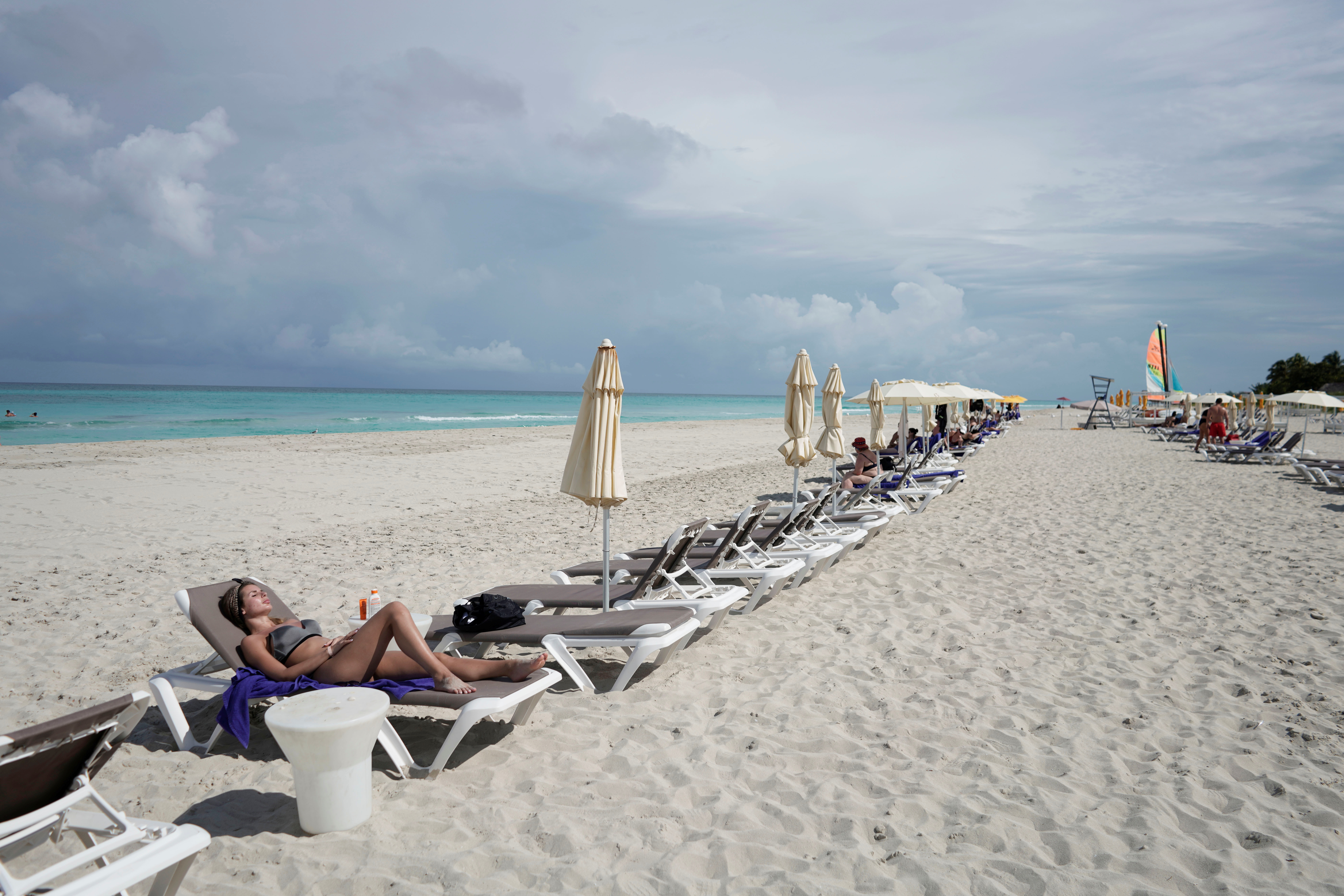 A tourist sunbathes amid concerns about the spread of the coronavirus disease (COVID-19) in Varadero, Cuba, October 22, 2021. Picture taken on October 22, 2021. REUTERS/Alexandre Meneghini