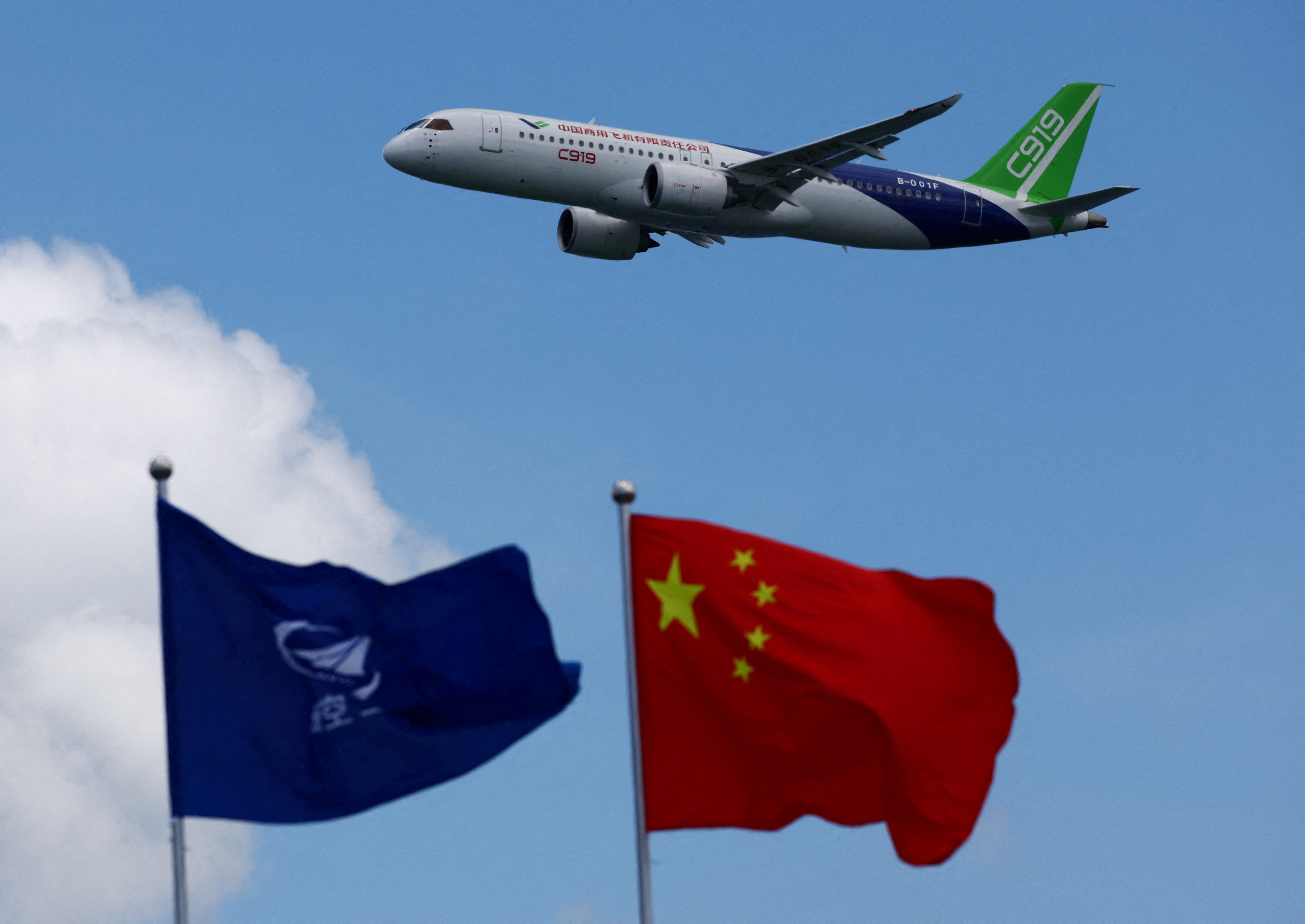 A Comac C919 flies during an aerial display at the Singapore Airshow at Changi Exhibition Centre in Singapore