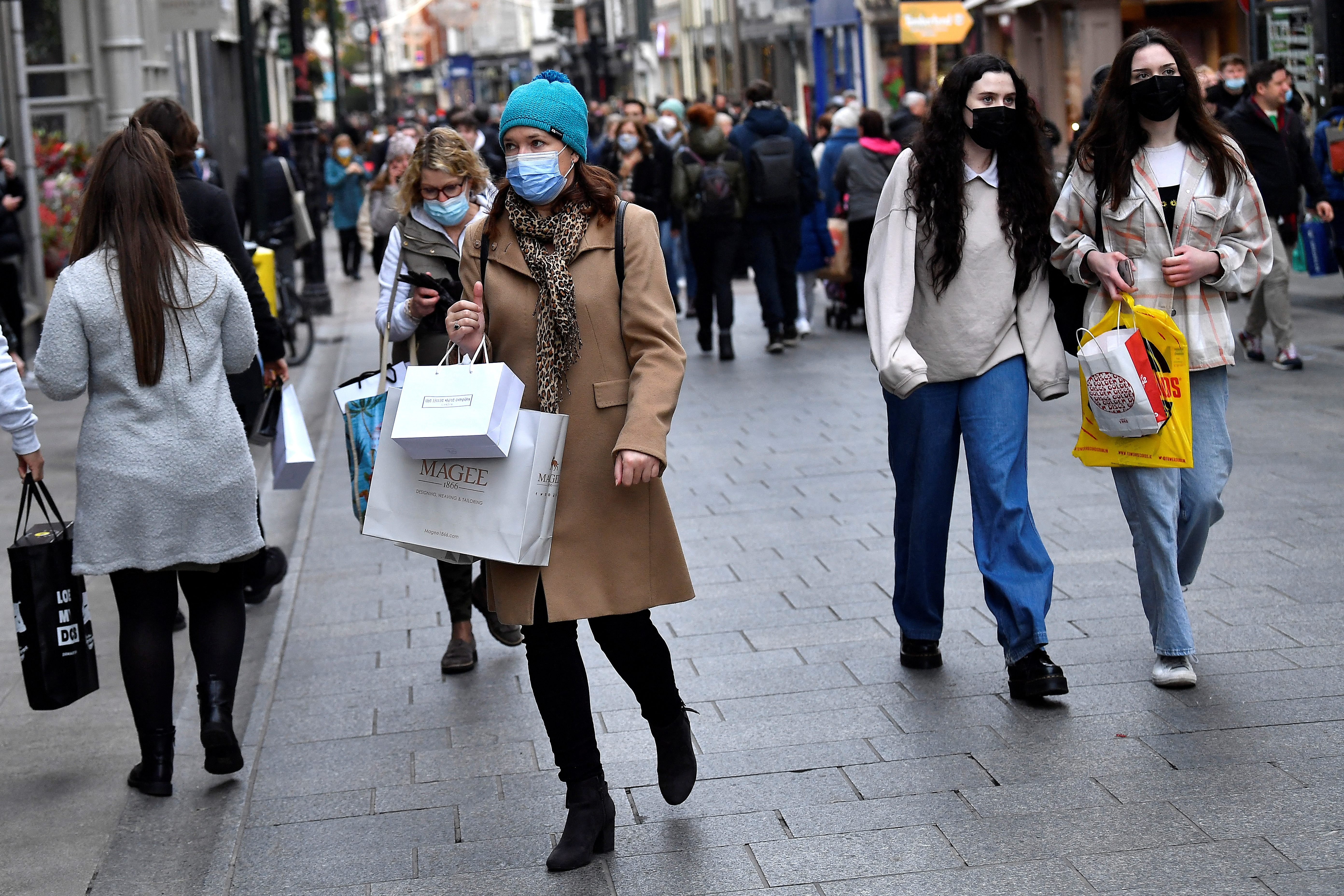 People wear protective face masks while out for Christmas shopping in Dublin