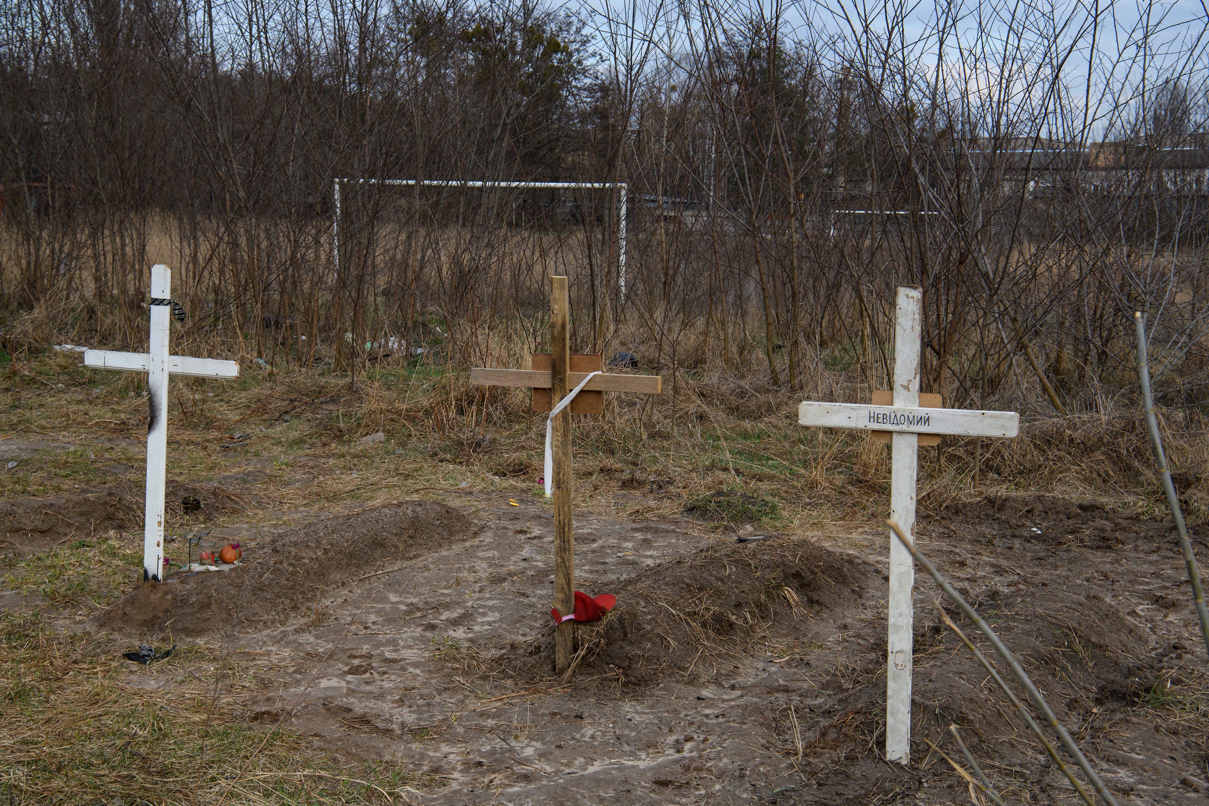 Graves with bodies of civilians, who according to local residents were killed by Russian soldiers, are seen, in Bucha