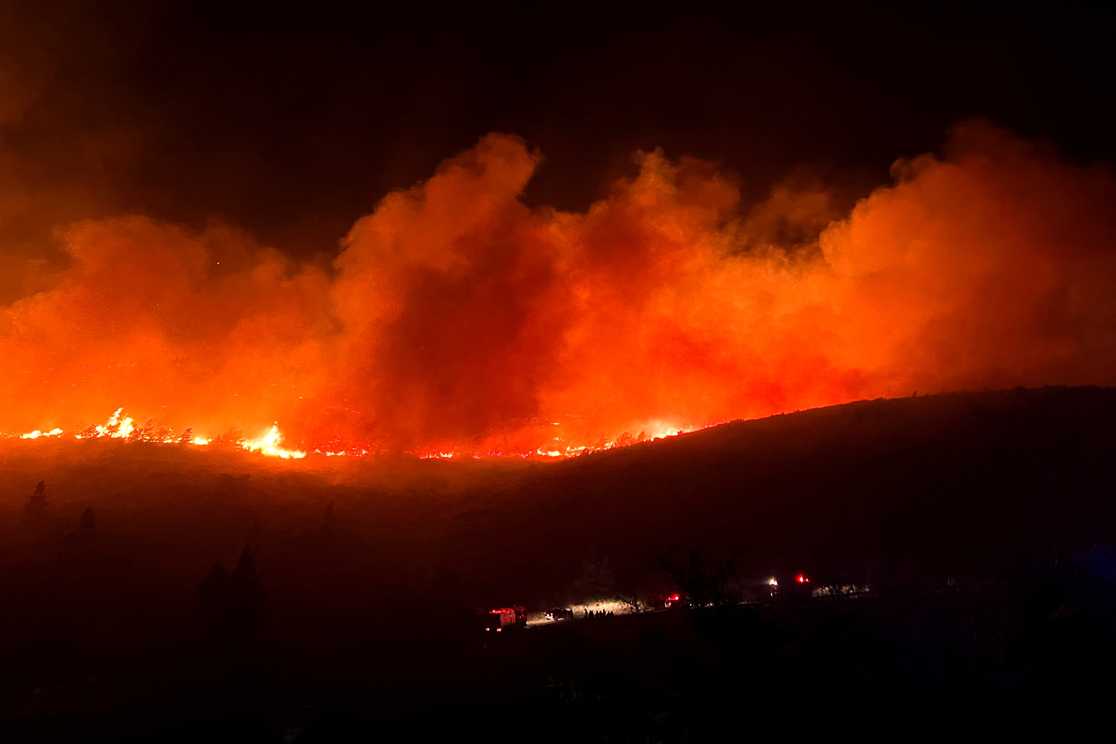 Greek wildfire rages near Athens; homes, hospital evacuated | Reuters