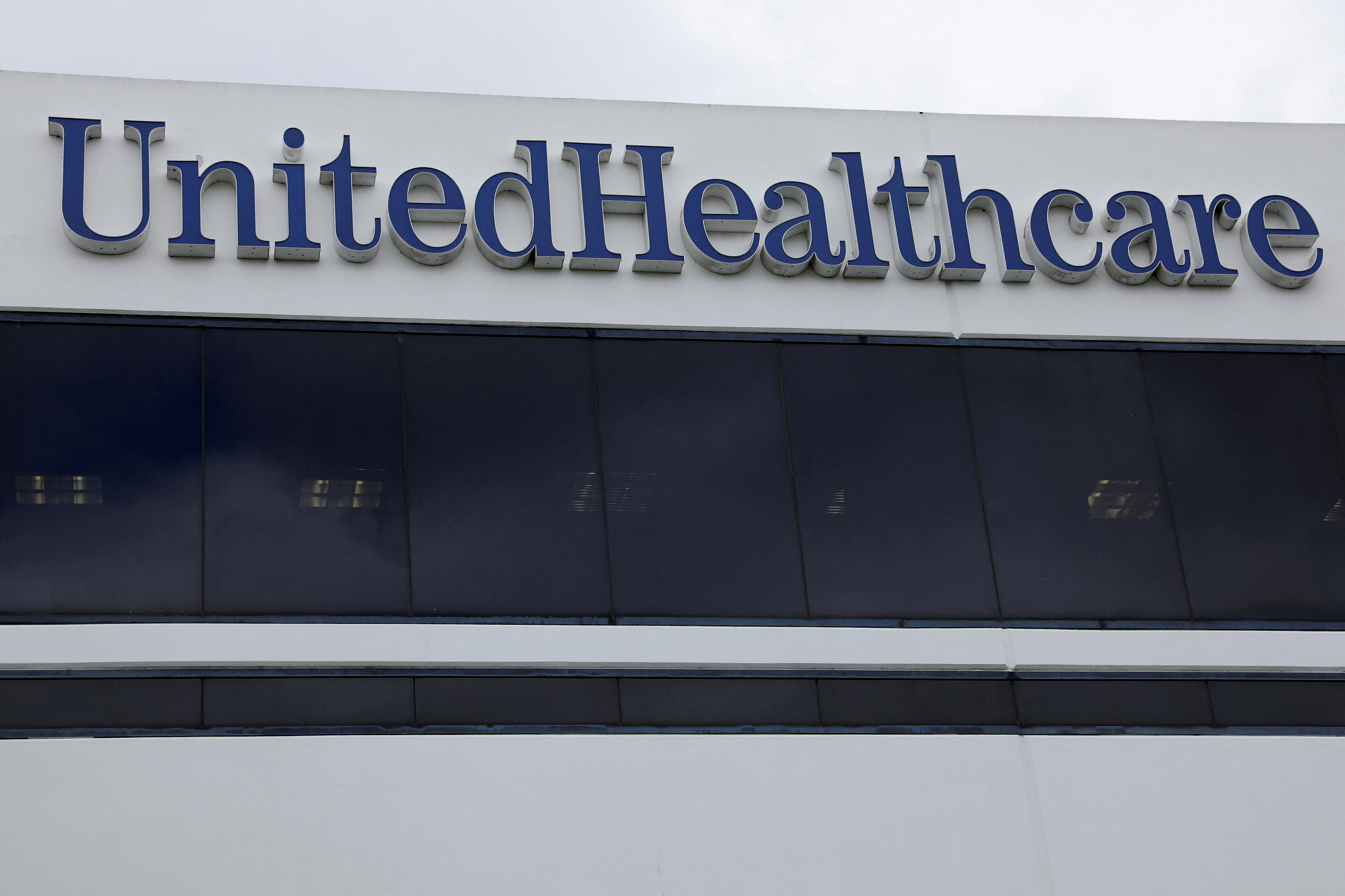 The corporate logo of the UnitedHealth Group appears on the side of one of their office buildings in Santa Ana, California