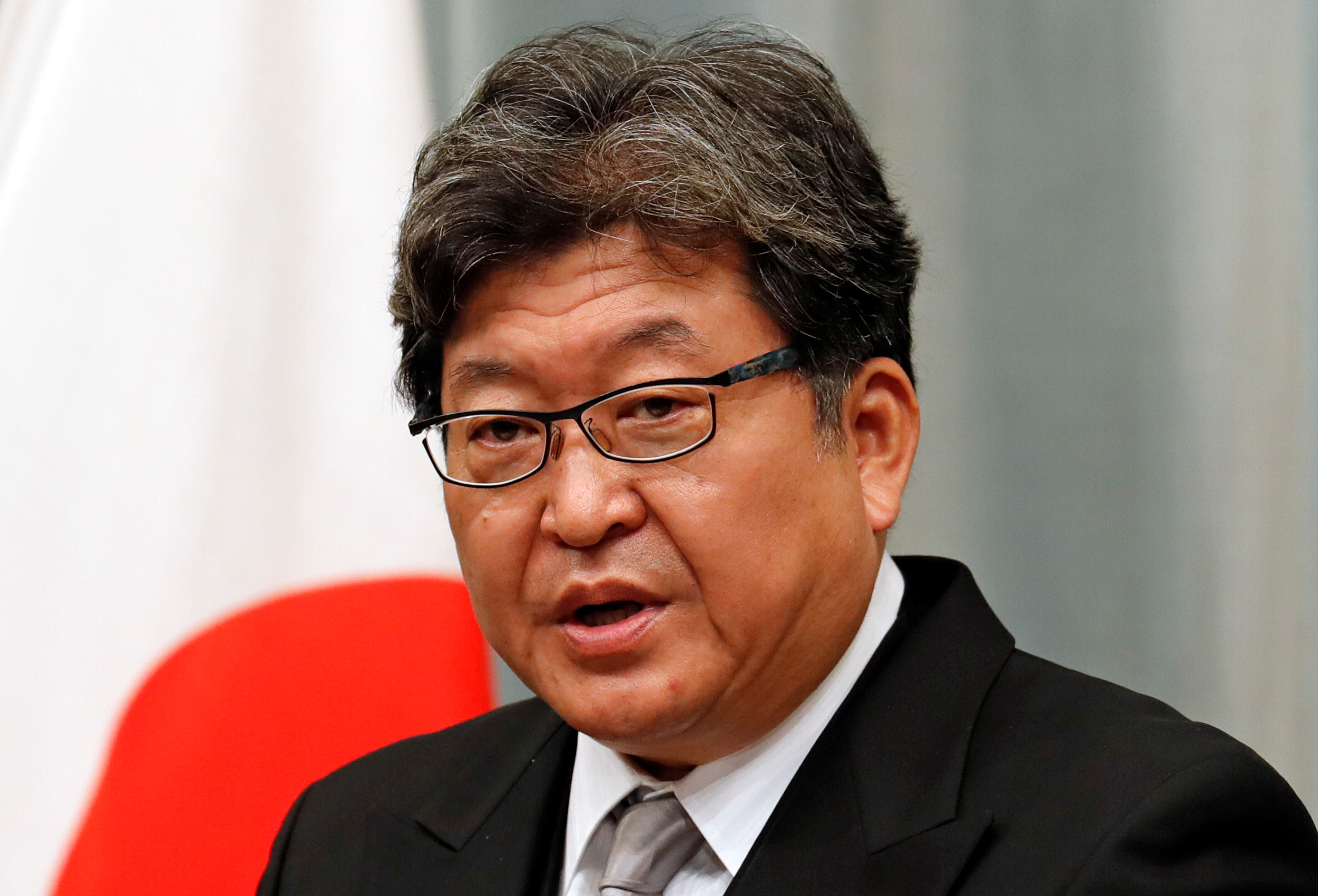 Koichi Hagiuda speaks at a news conference in Tokyo
