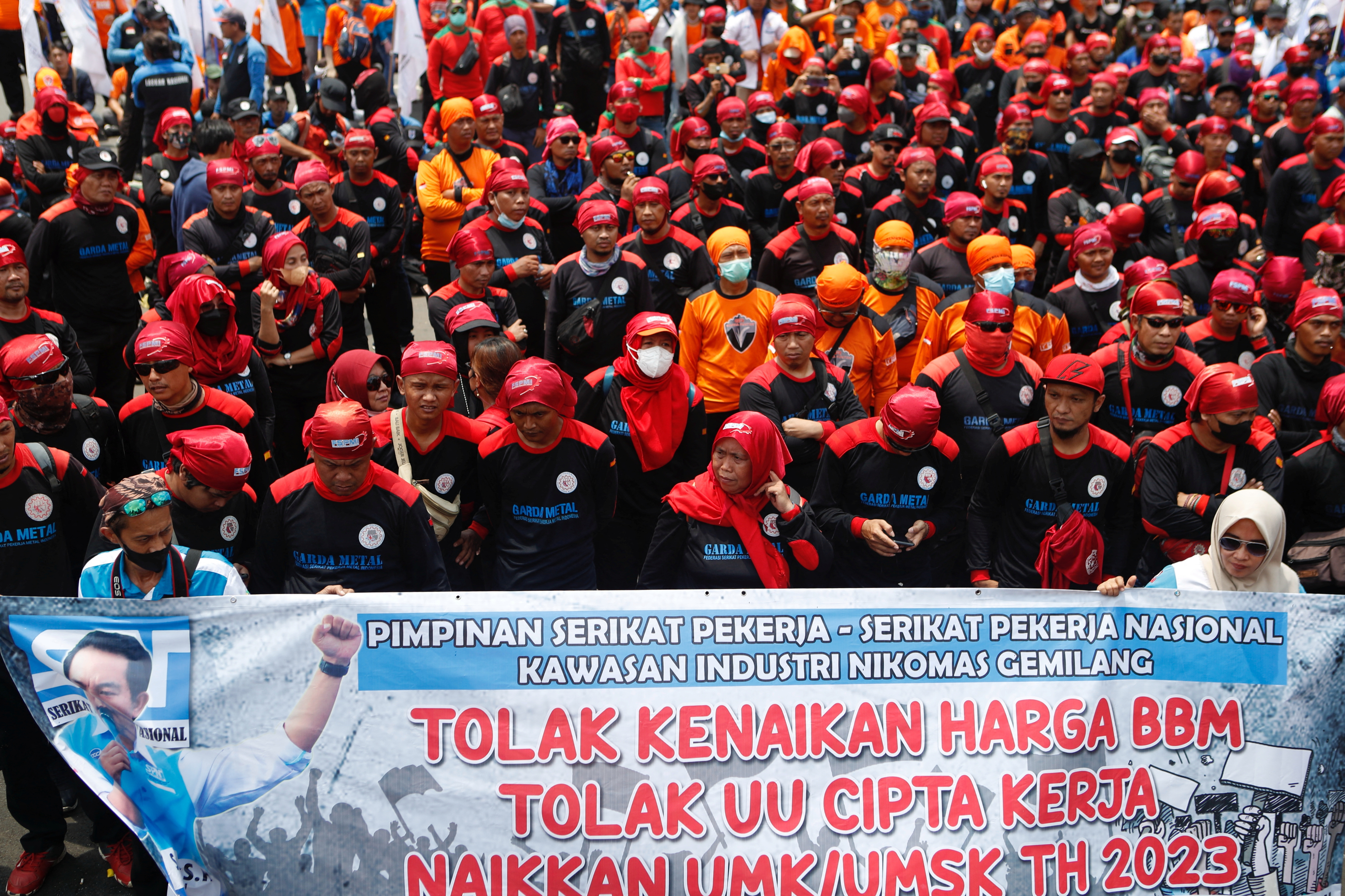 Members of Indonesian labour organizations protest against the government outside the Indonesian Parliament following raised subsidised fuel prices in Jakarta,