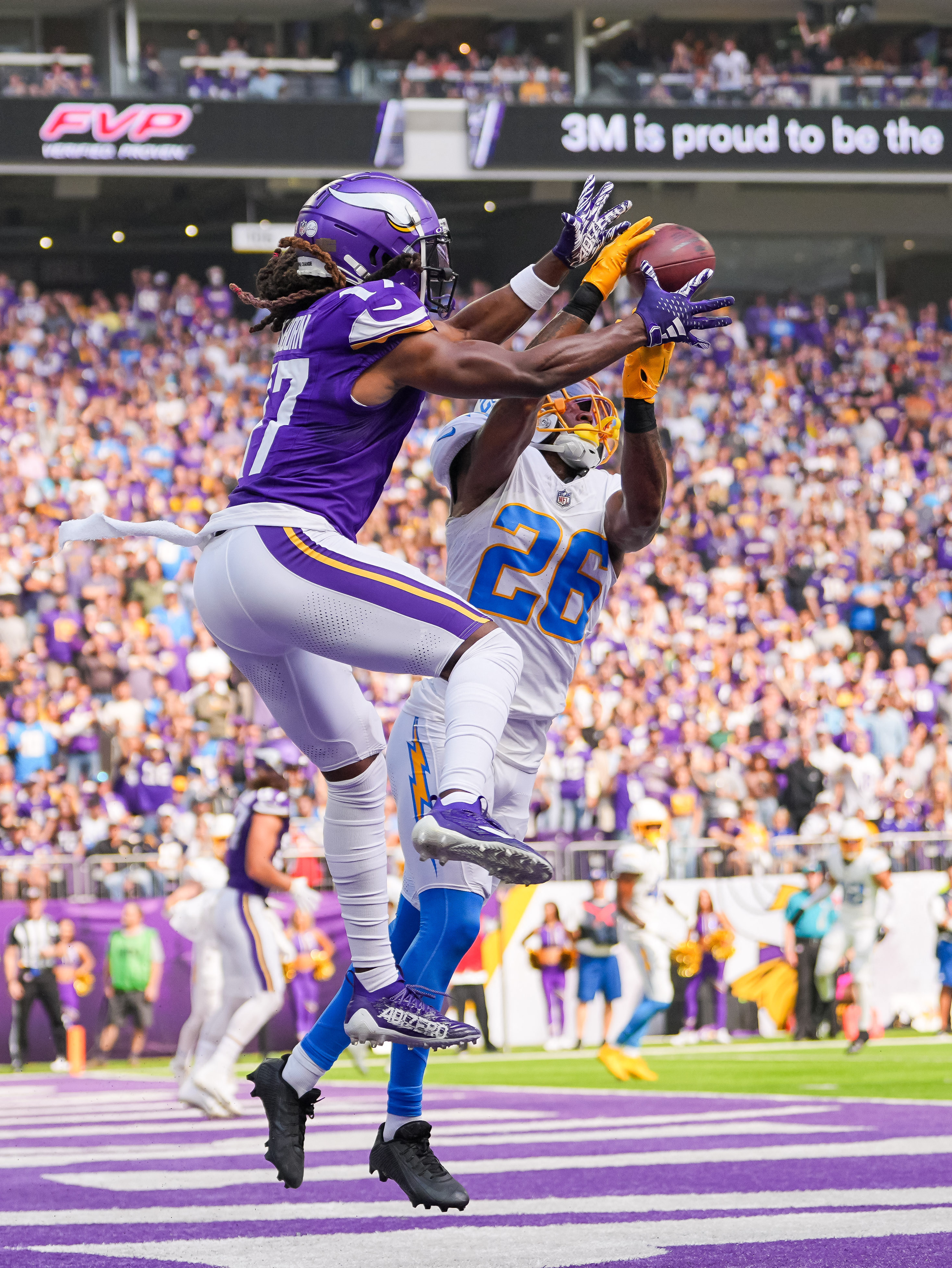 Chargers survive cliff-hanger with Vikings on end zone pick