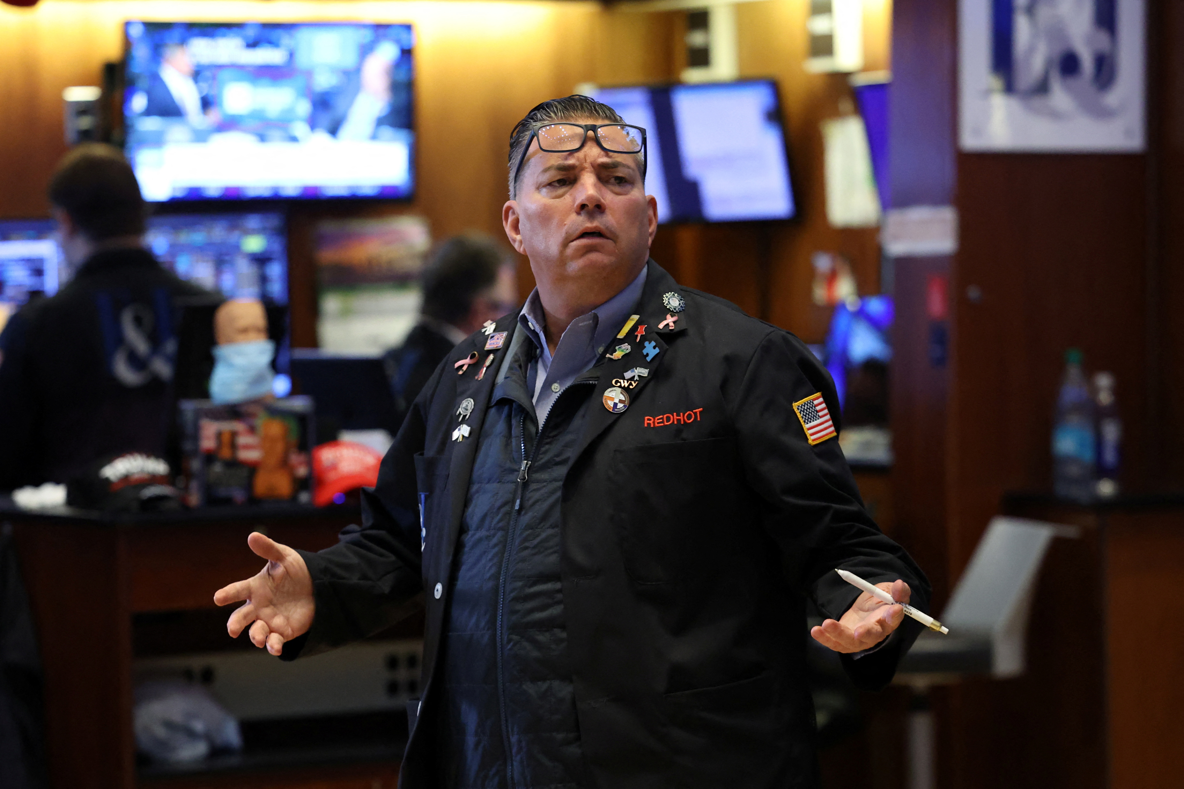 Traders work on the floor of the NYSE in New York