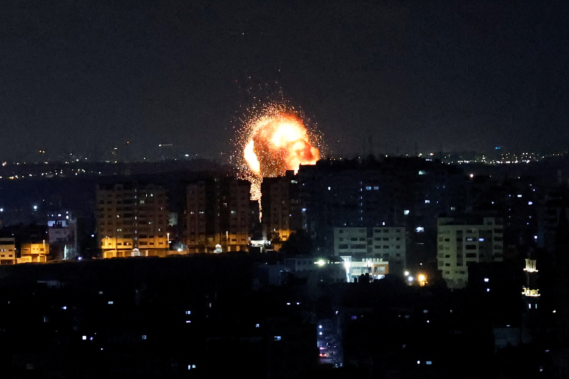 An explosion is seen as Israel strikes Gaza