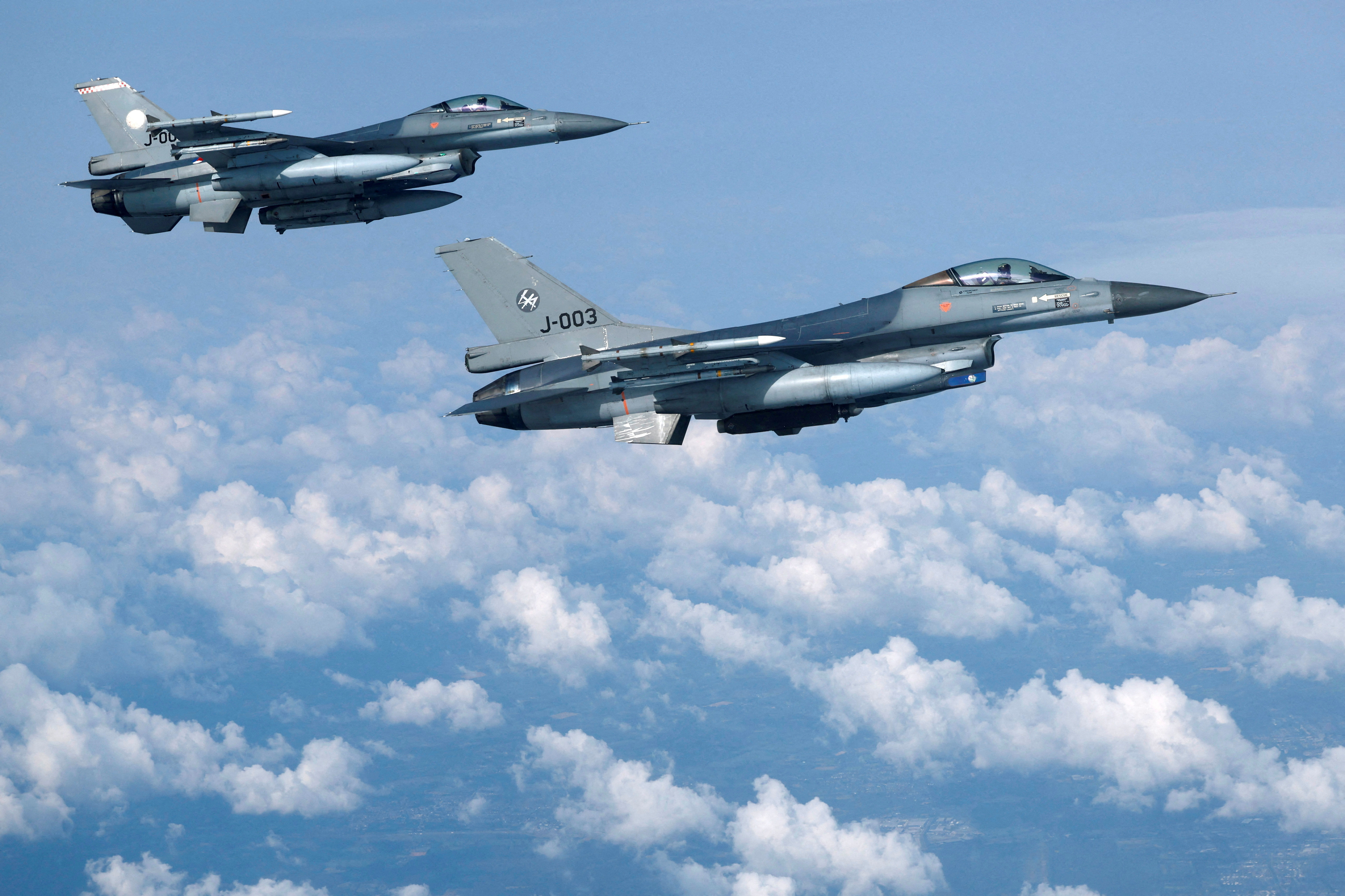 Netherlands' Air Force F-16 fighter jets fly during a media day