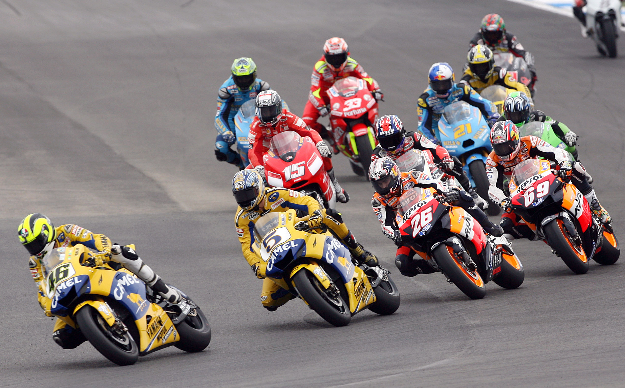Yamaha motoGP rider Valentino Rossi of Italy leads the pack of riders at the start of the Portugese Grand Prix