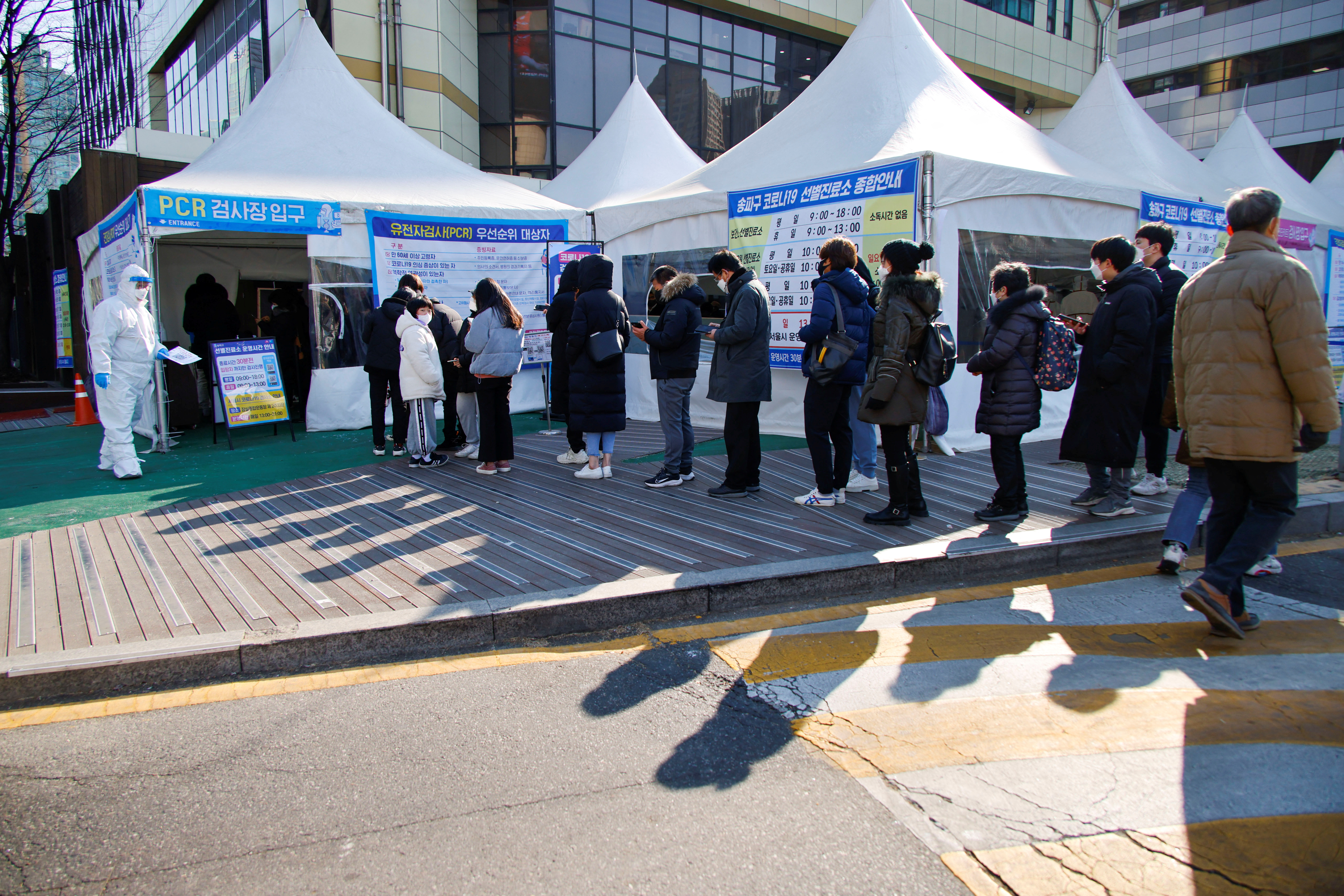 People wait in line for coronavirus disease (COVID-19) test in Seoul