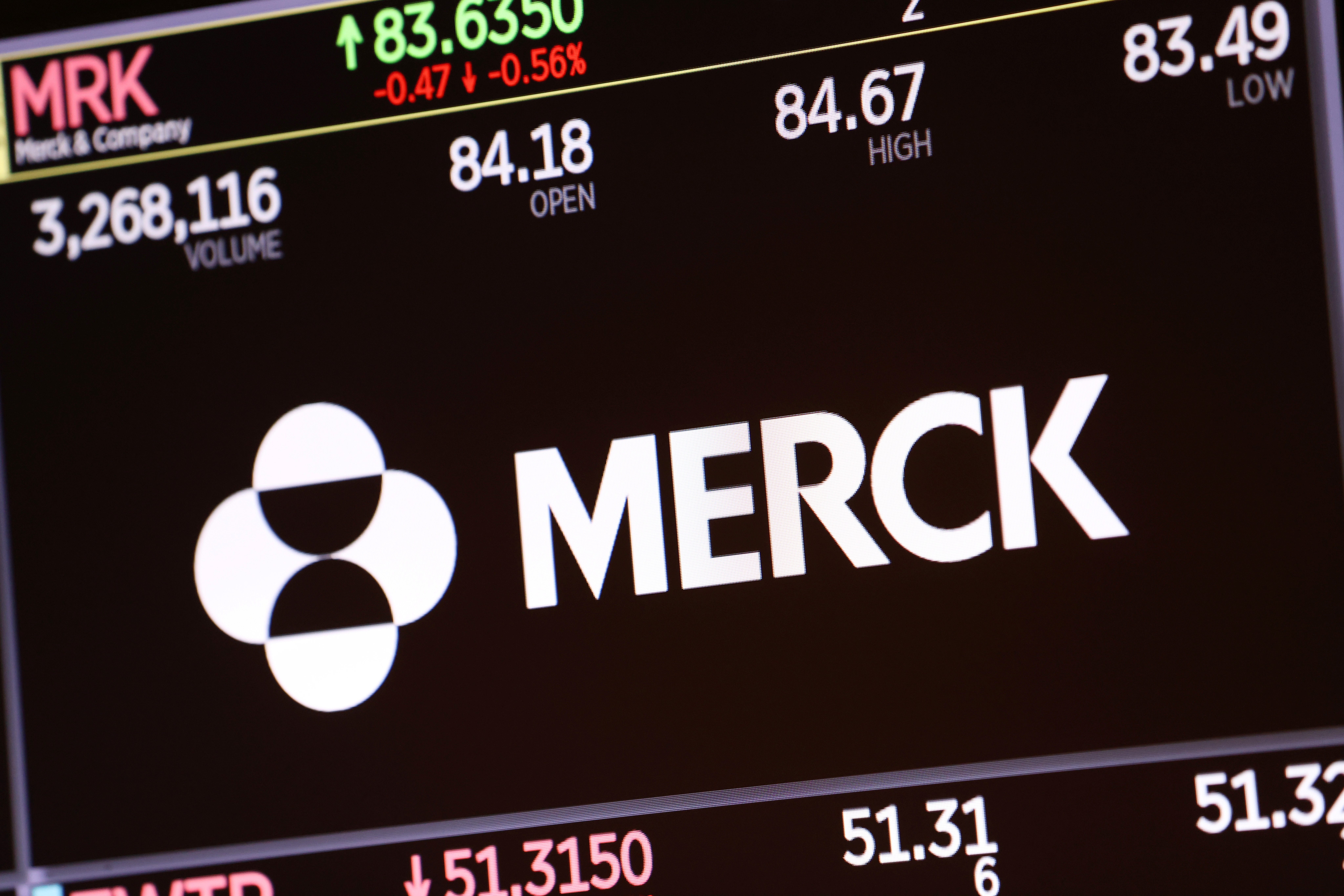 The logo for Merck & Co. is displayed on a screen at the New York Stock Exchange (NYSE) in New York City