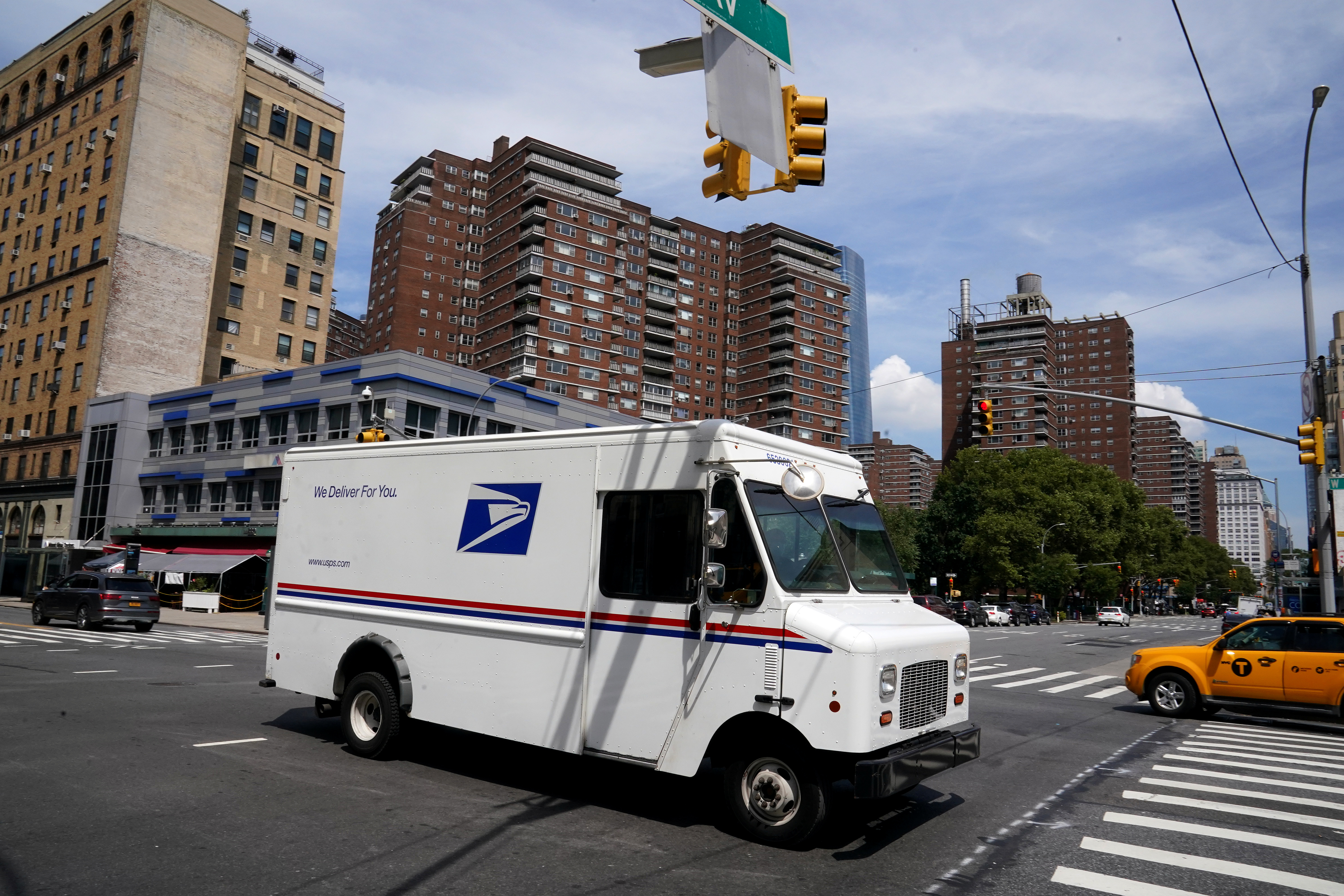 A U.S. Postal Service (USPS) truck is pictured