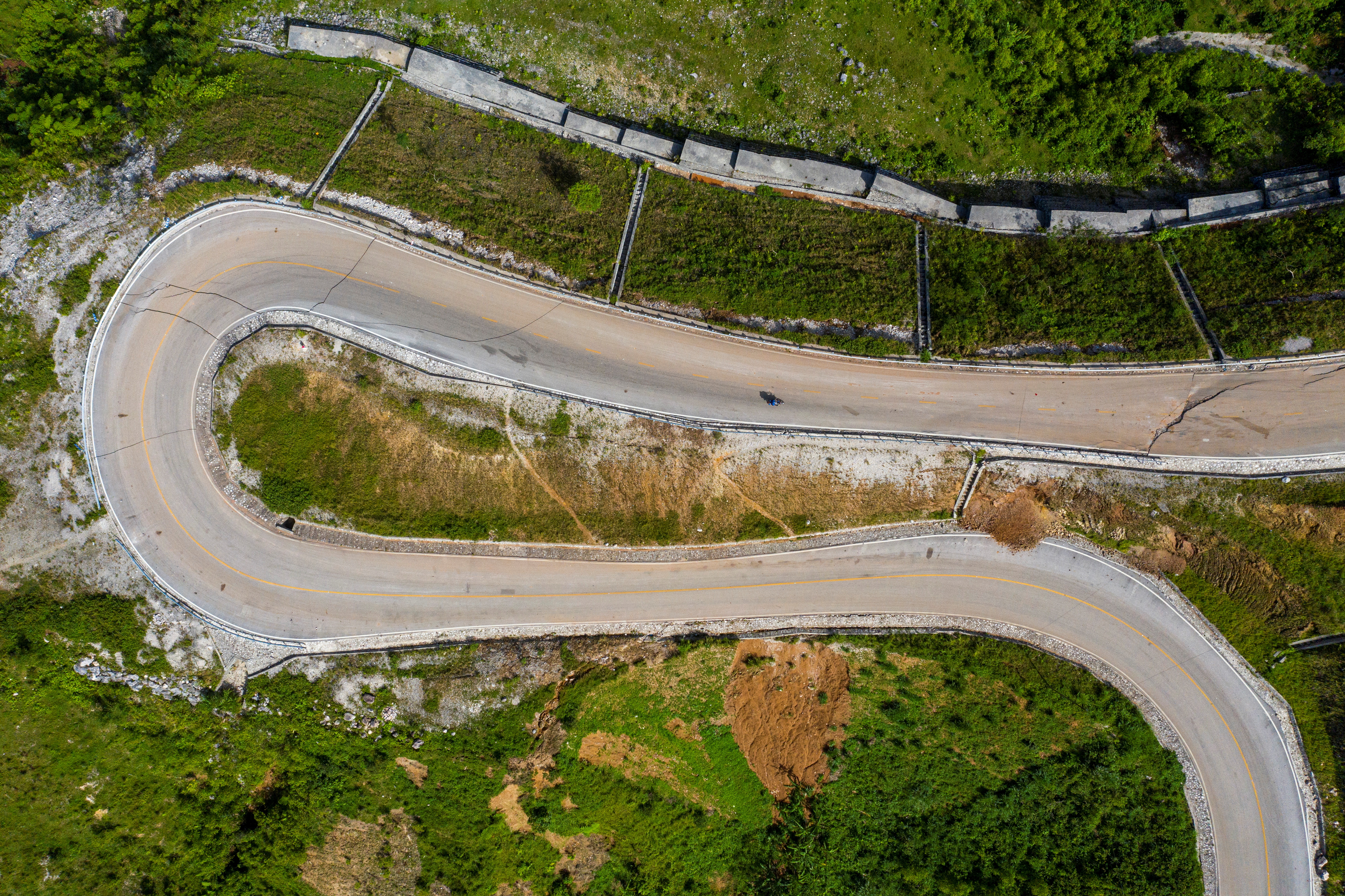 An aerial view on a road with cracks caused by a 7.2 magnitude quake in Marceline, Haiti August 22, 2021. REUTERS/Ricardo Arduengo