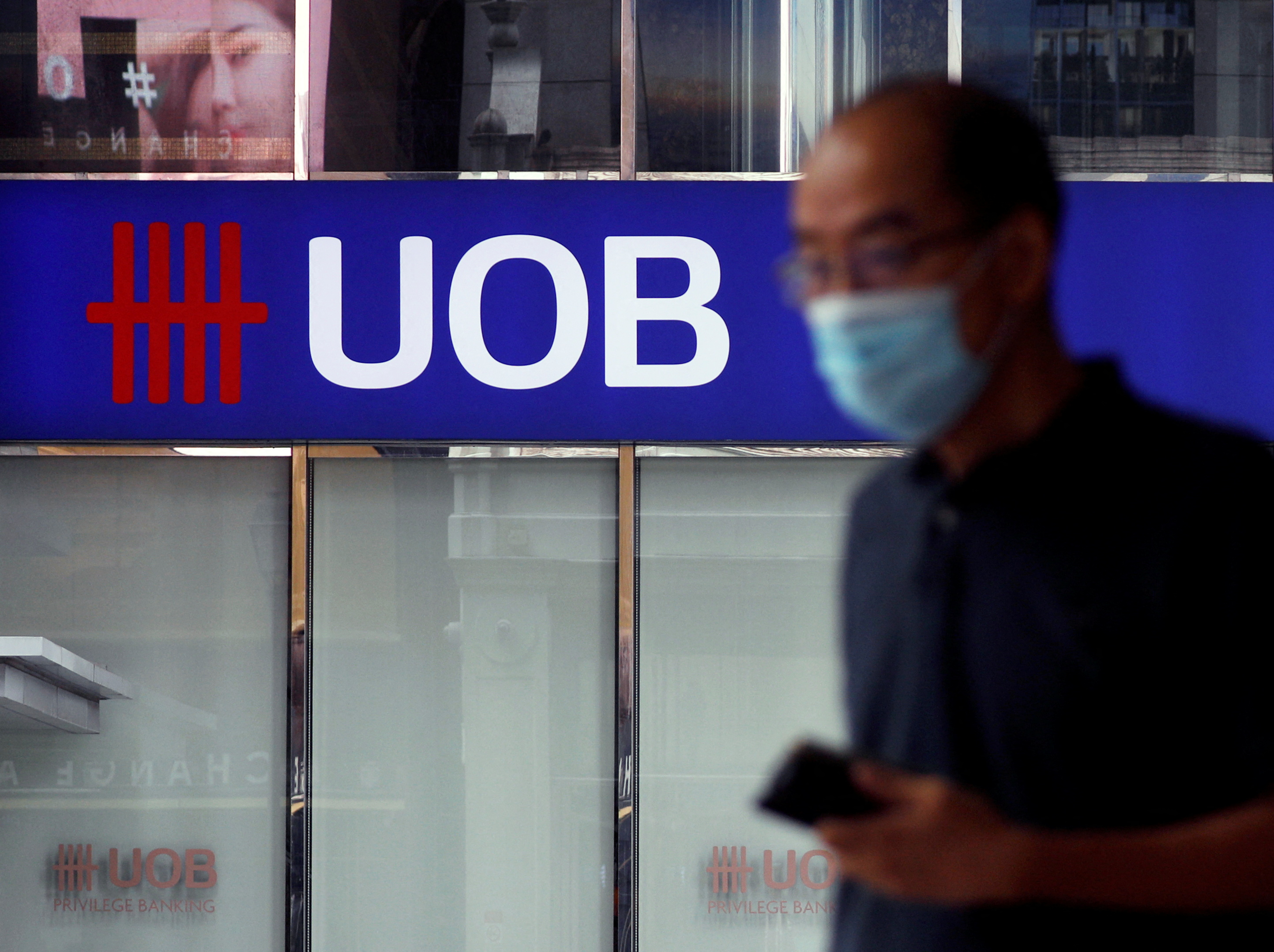 A man passes by a UOB bank branch in Singapore November 4, 2020. REUTERS/Edgar Su