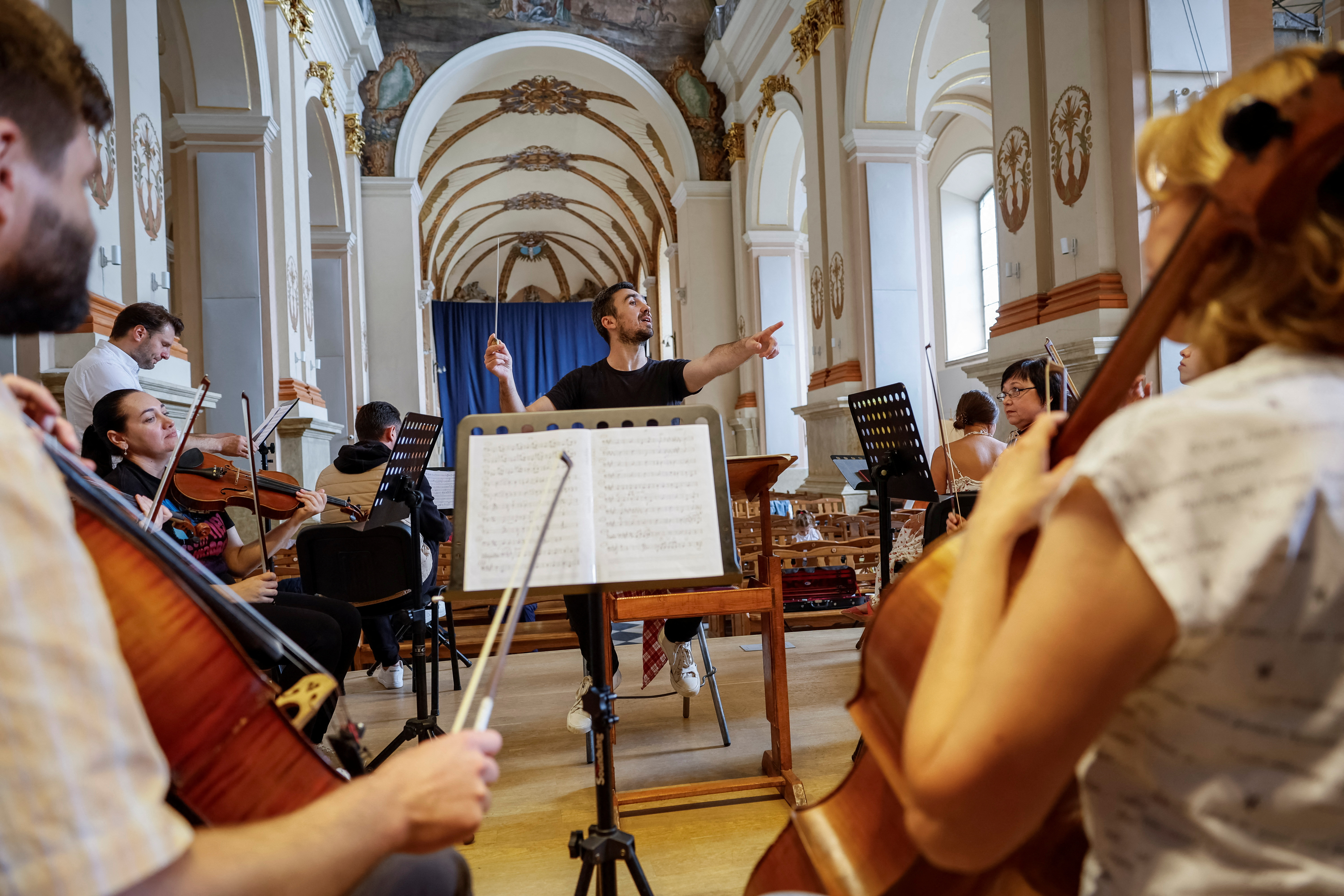 Ivan Ostapovych, Lviv Organ Hall's co-director and conductor, rehearses with musicians of the Luhansk Philharmonic