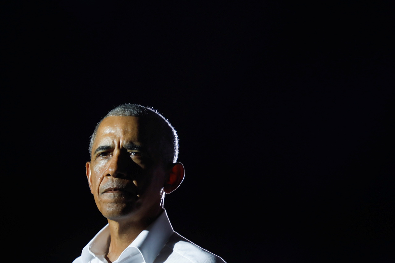 Former U.S. President Barack Obama looks on during a drive-in campaign rally on behalf of Democratic presidential nominee and former Vice President Joe Biden in Miami