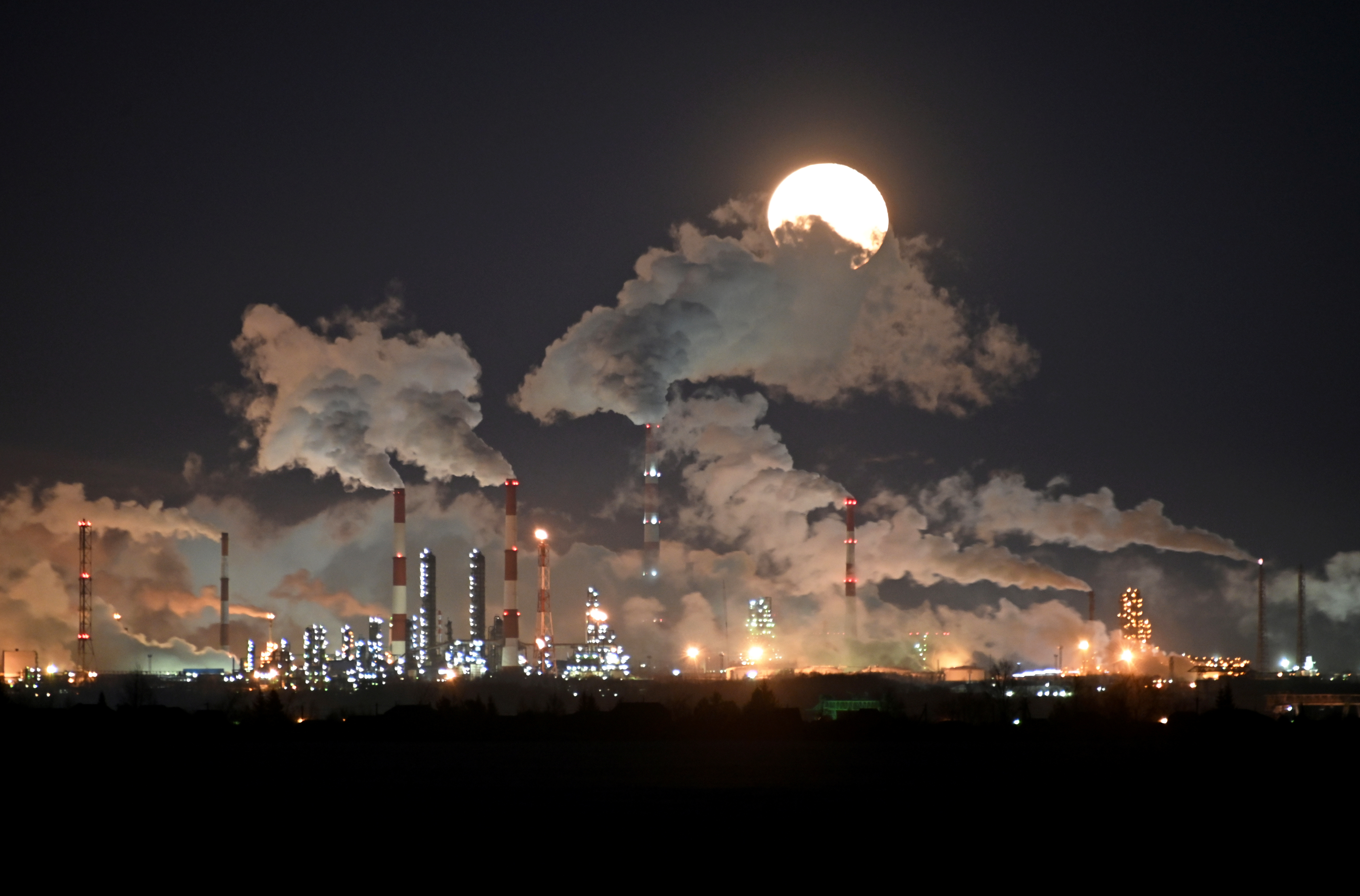 Full moon rises over the Gazprom Neft's oil refinery in Omsk