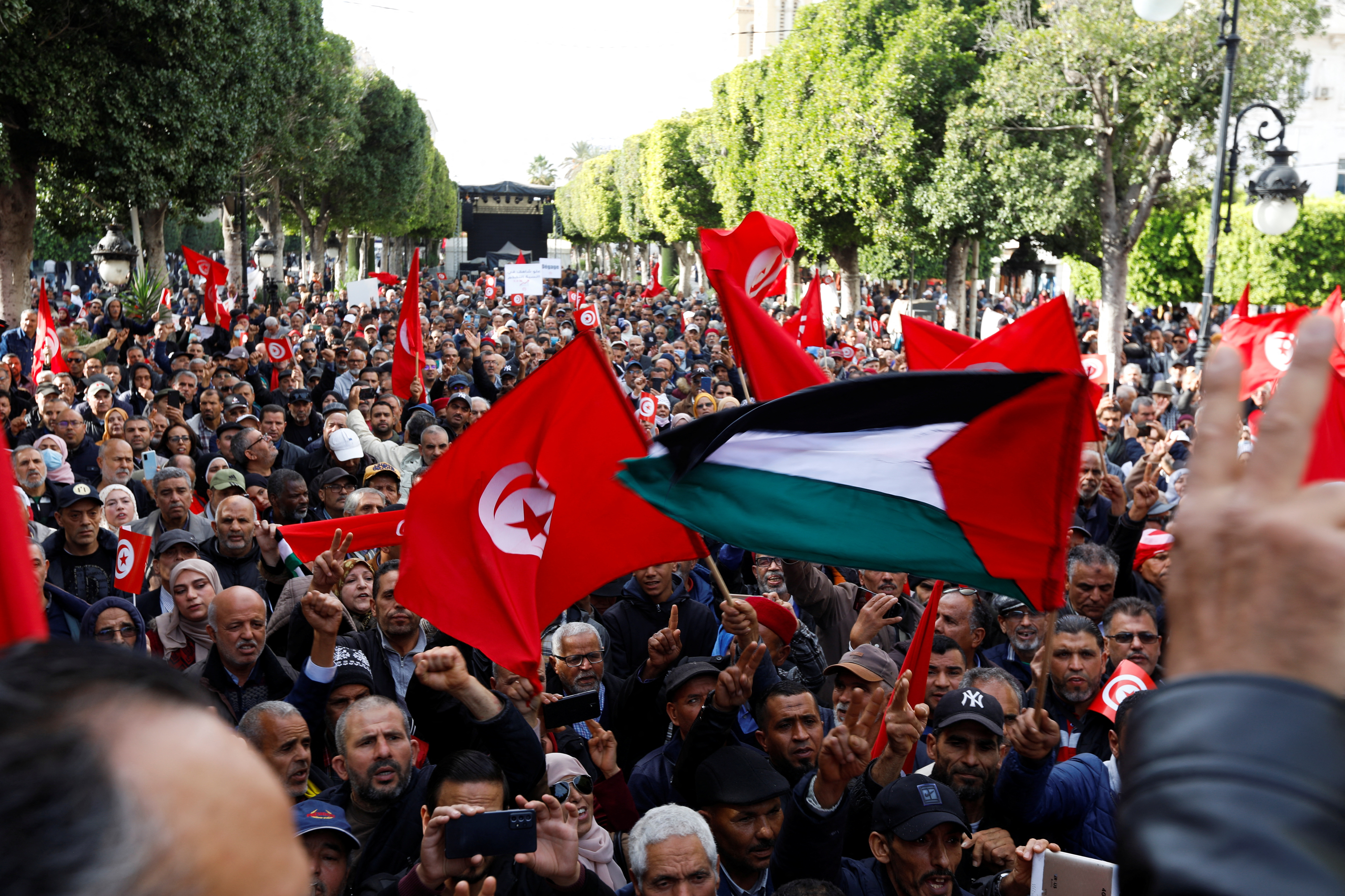 Supporters of Tunisian opposition groups protest against the upcoming parliamentary election in Tunis