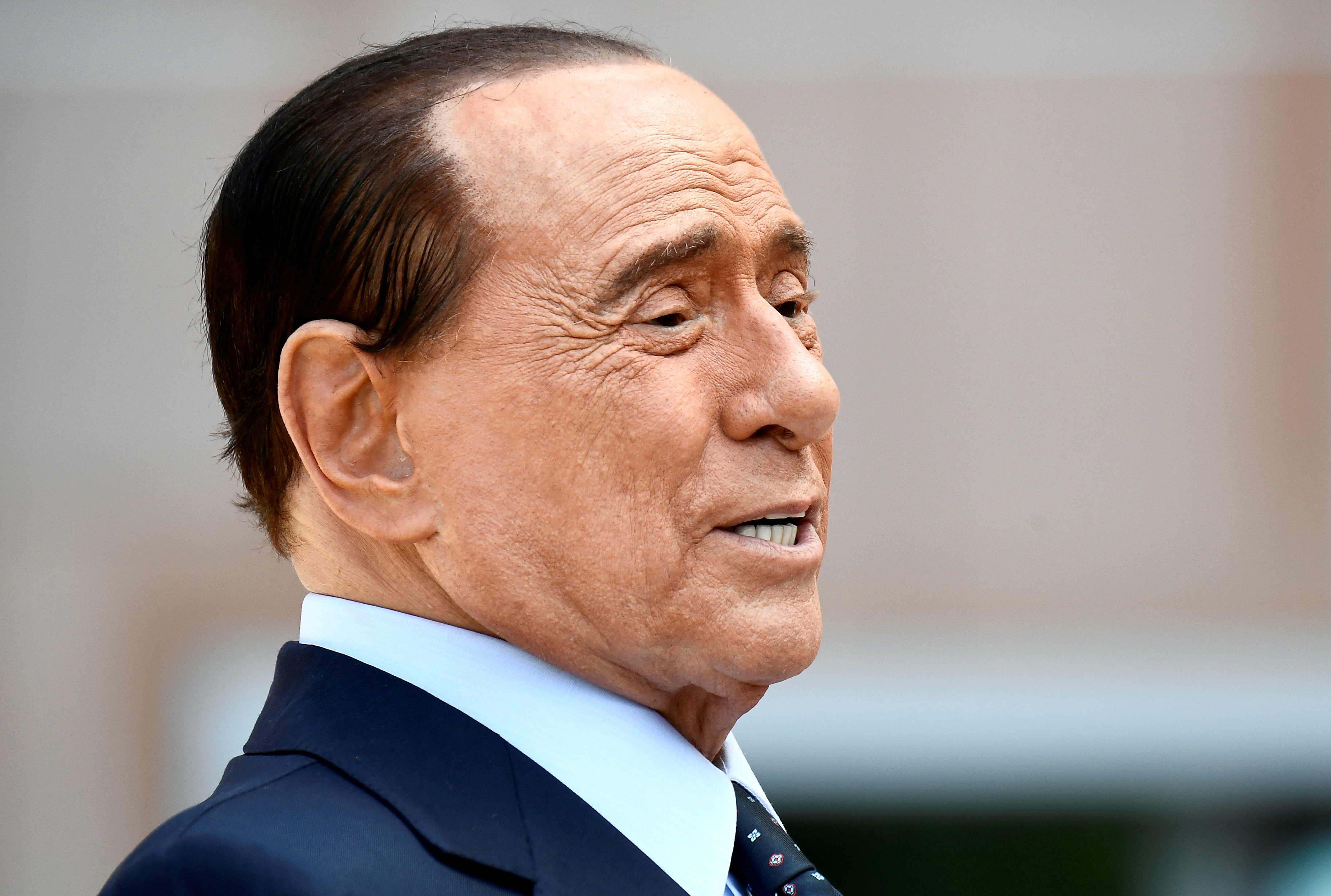 Former Italian Prime Minister Silvio Berlusconi speaks to the media as he leaves San Raffaele hospital in Milan, Italy, September 14, 2020. REUTERS/Flavio Lo Scalzo