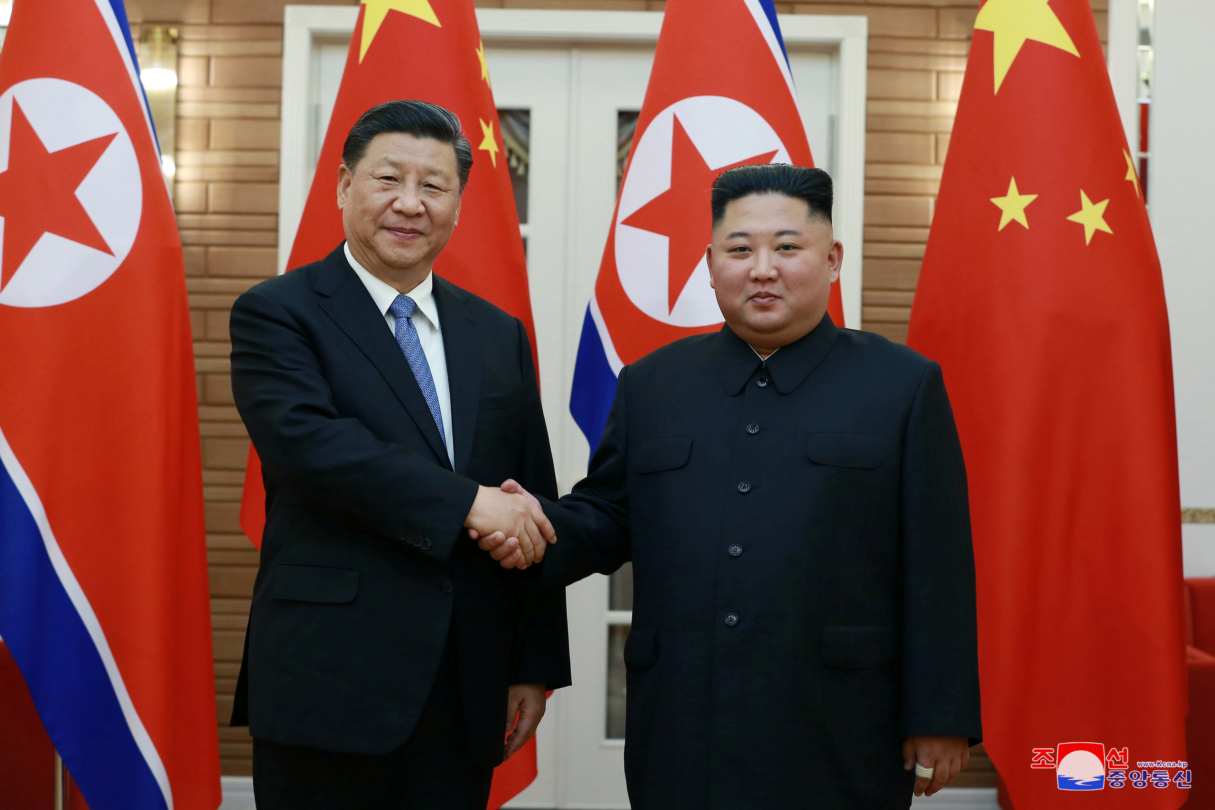 North Korean leader Kim Jong Un shakes hands with China's President Xi Jinping during Xi's visit in Pyongyang, North Korea in this undated photo released on June 21, 2019 by North Korea's Korean Central News Agency (KCNA)