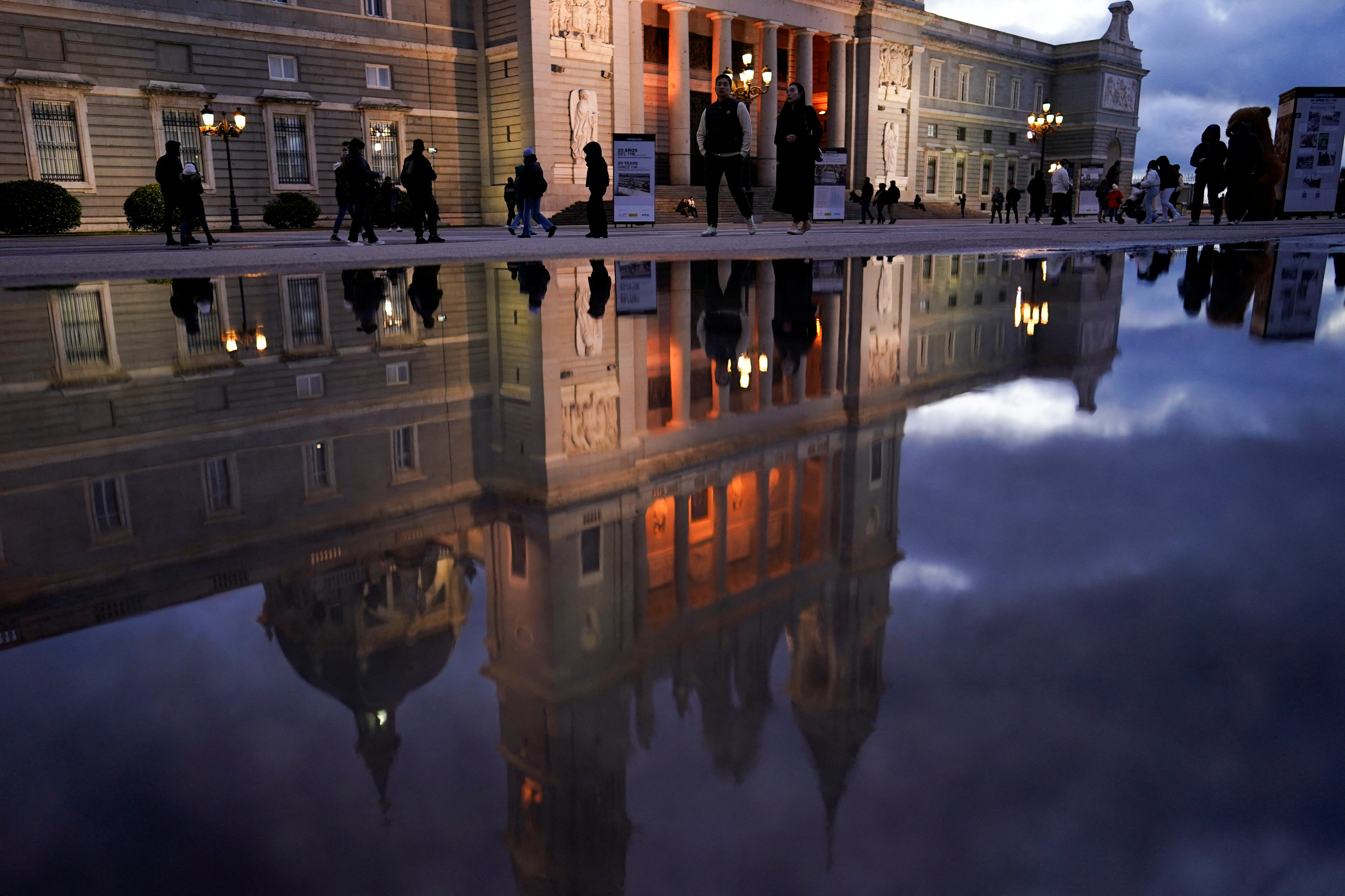 People walk along Armory Square after a rainy day in Madrid