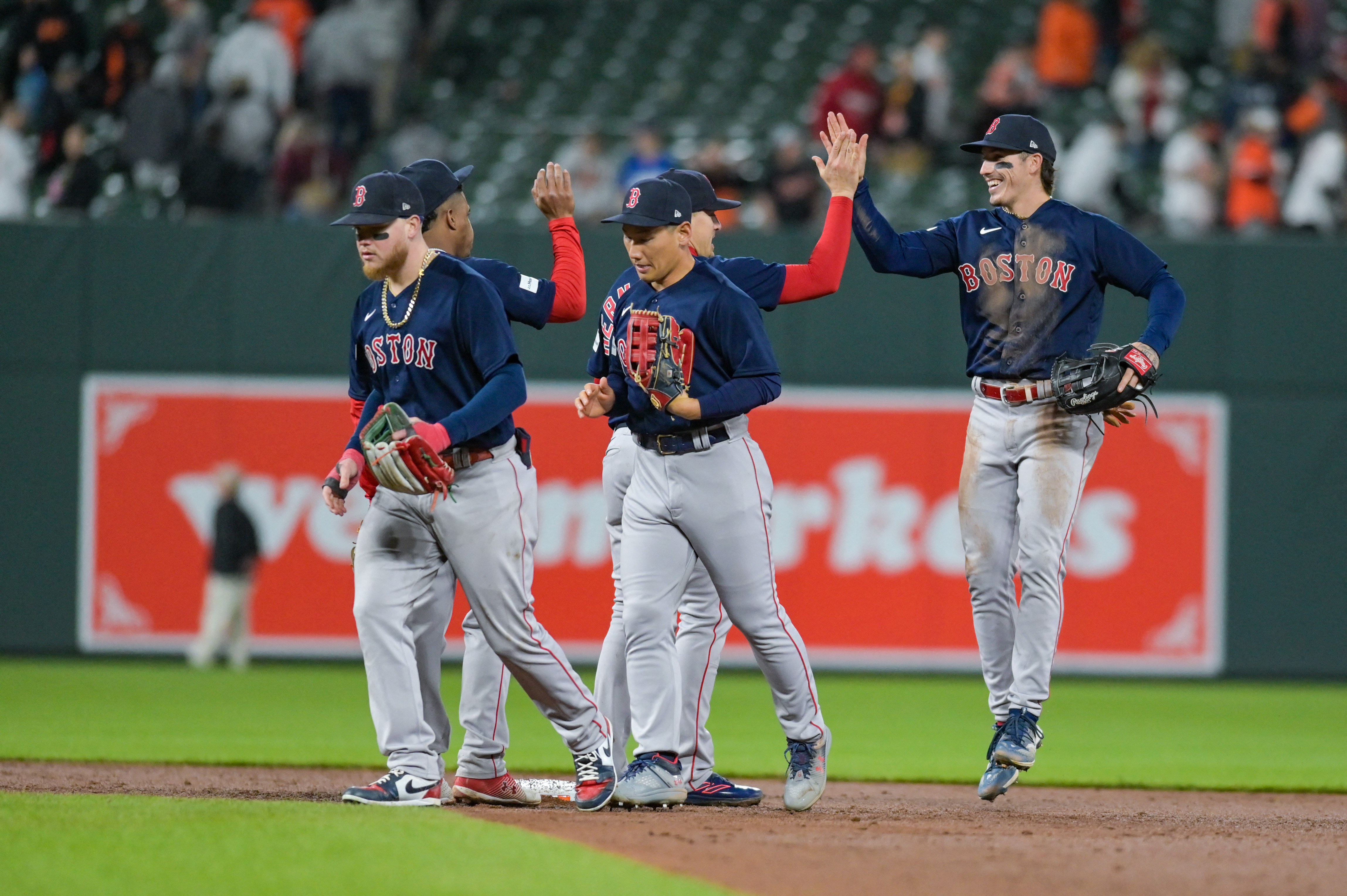 Boston Red Sox center fielder Jarren Duran throws the ball after making a  catch in the first inning of a baseball game between the Baltimore Orioles  and the Boston Red Sox, Wednesday