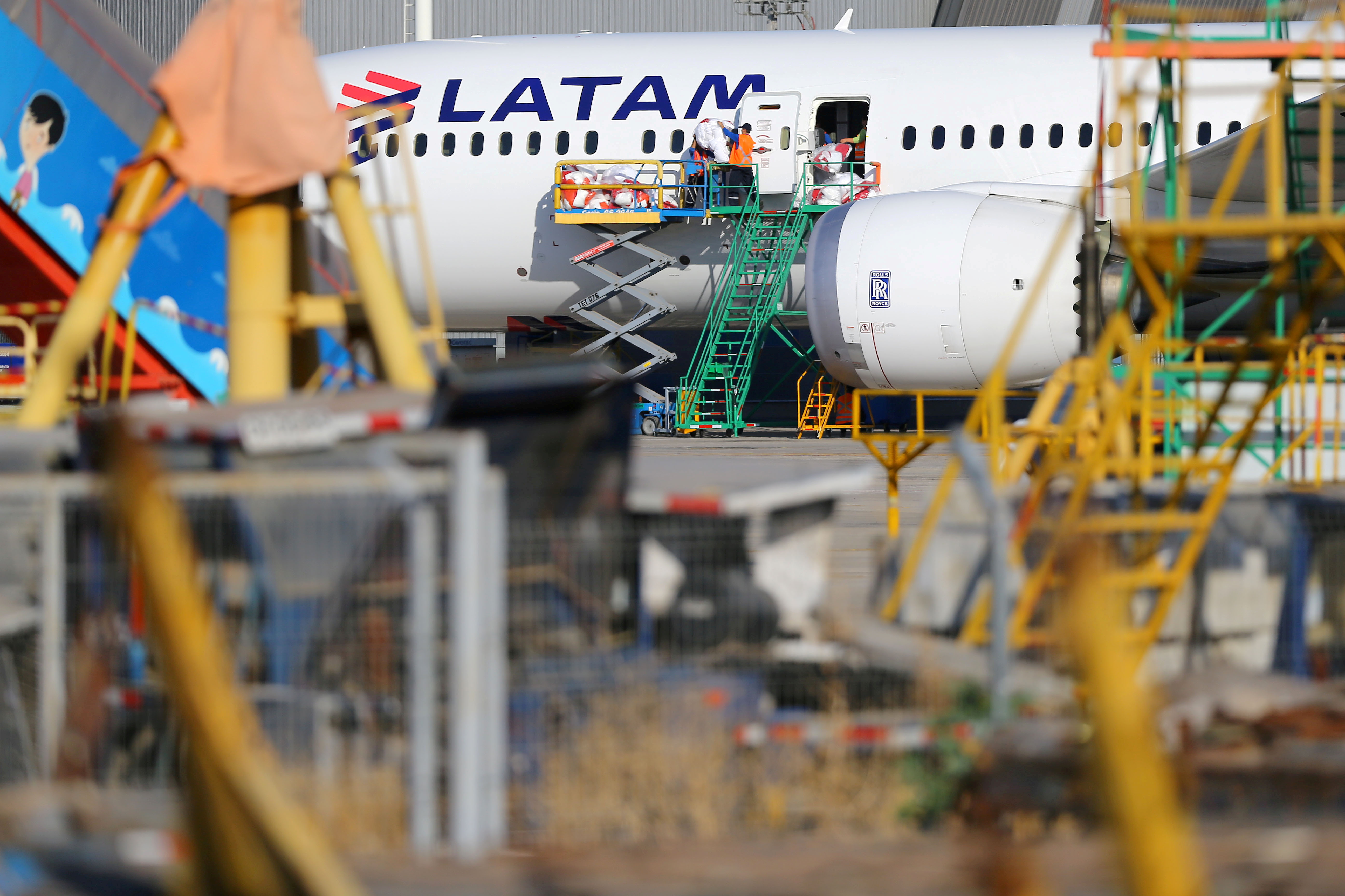 LATAM Airlines plane is seen at Santiago International Airport, Chile March 30, 2017. REUTERS/Ivan Alvarado/File Photo