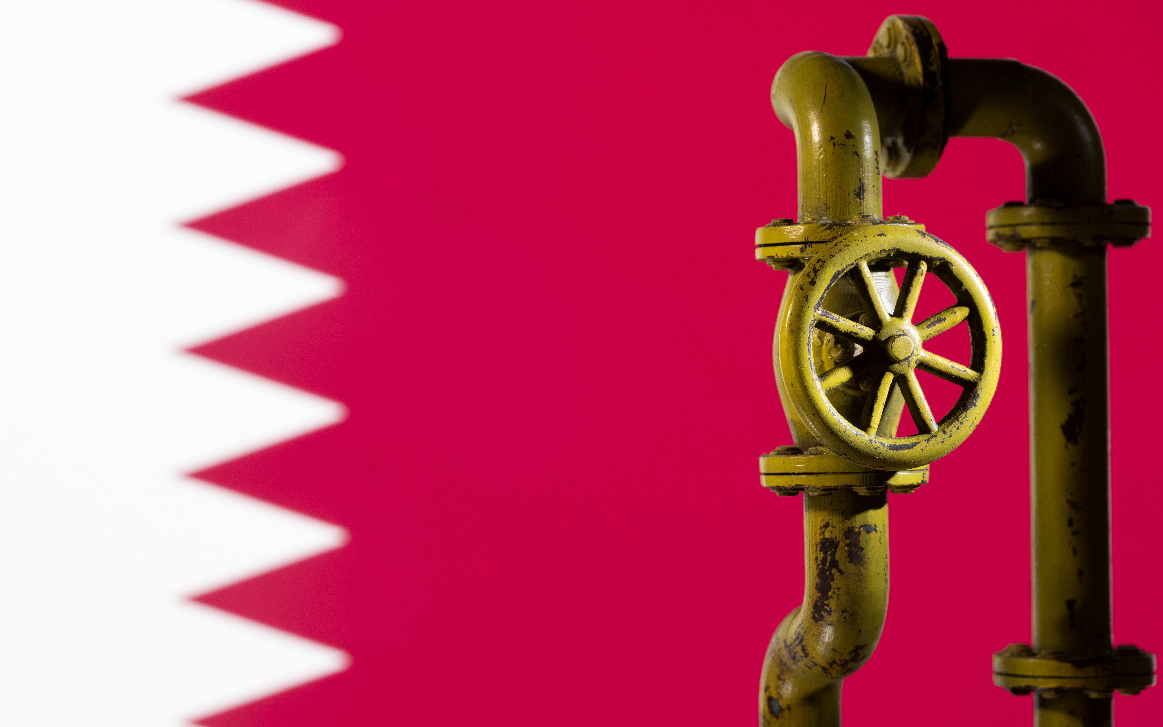Illustration shows Qatar flag and natural gas pipeline