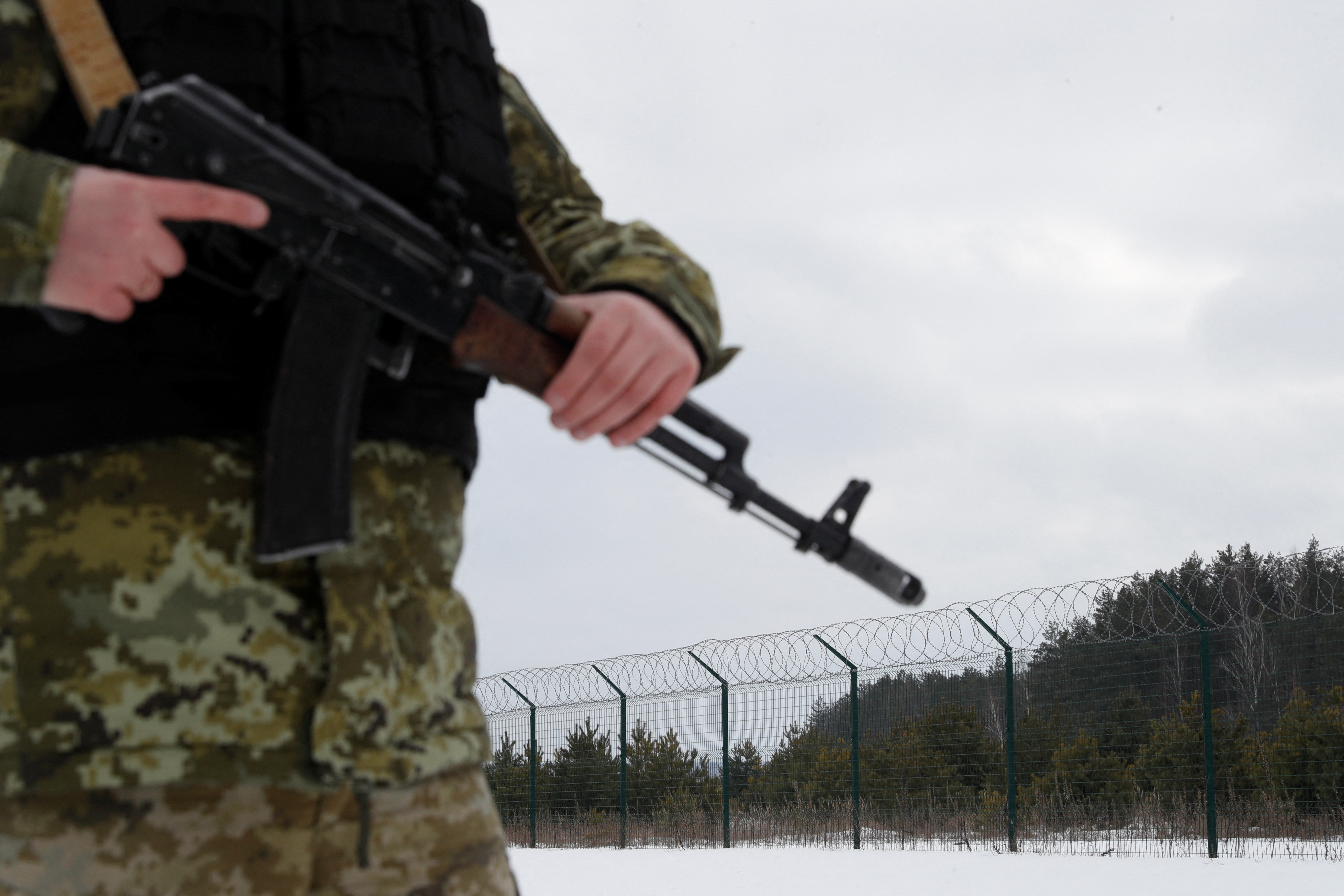 Ukrainian border guards patrol the area near the frontier with Russia in the Chernihiv region